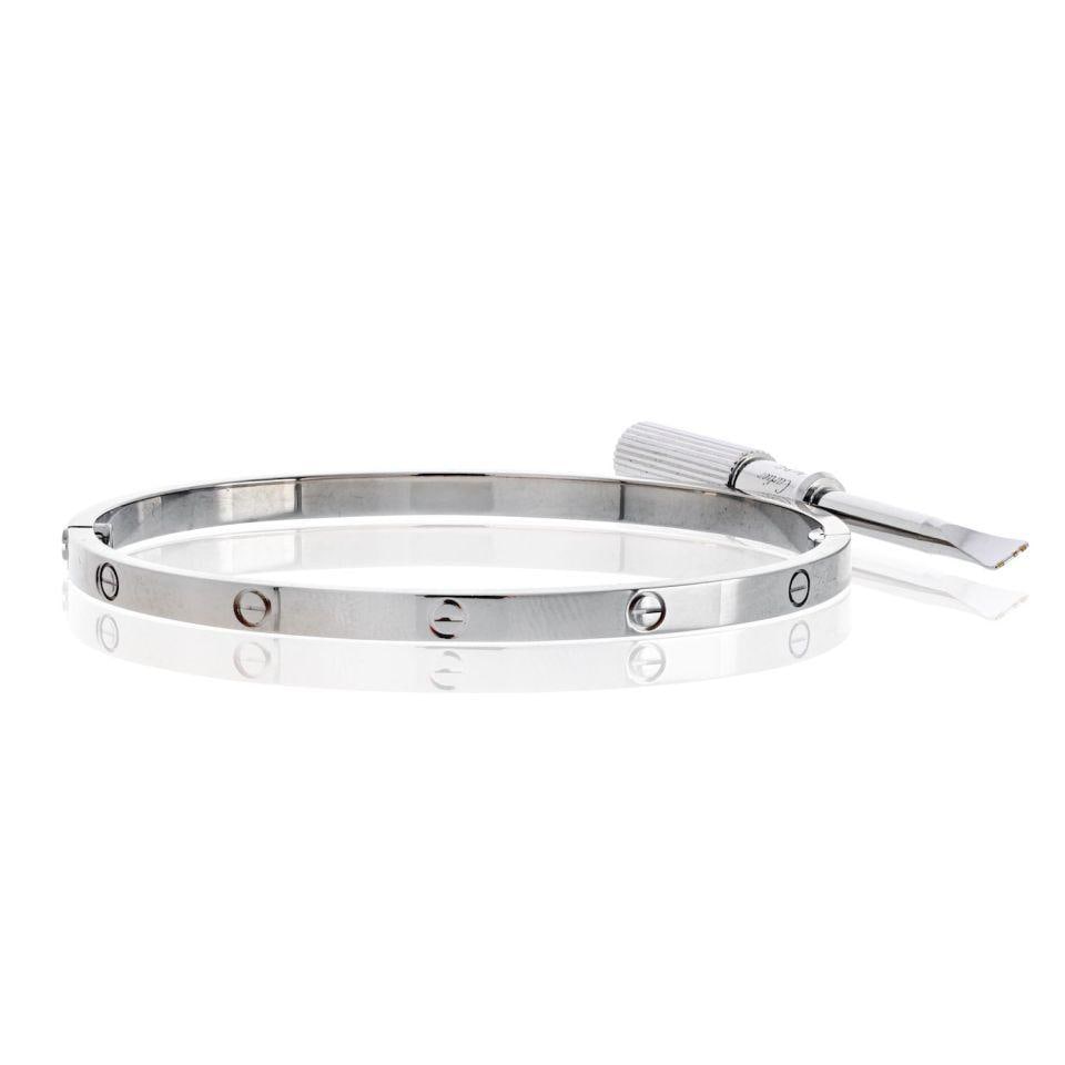Cartier Love Bracelet 18K White Gold Small Model Size 17: Cartier Love Bracelet 18K White Gold Small Model Size 17 This exquisite Cartier Love bracelet is crafted from 18K white gold, weighing 20.2 grams. As the elegant small model edition, it is sized at 17