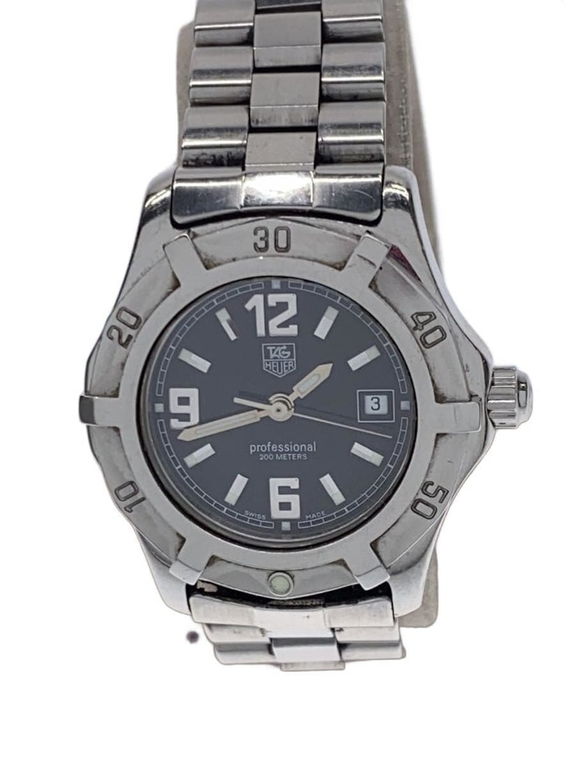 TAG Heuer WN1310 Stainless Steel Quartz Wristwatch: TAG Heuer WN1310 Stainless Steel Quartz Wristwatch This TAG Heuer Professional 200 Quartz WN1310 men's wristwatch features a classic black dial and a durable stainless steel case and band. Designed fo