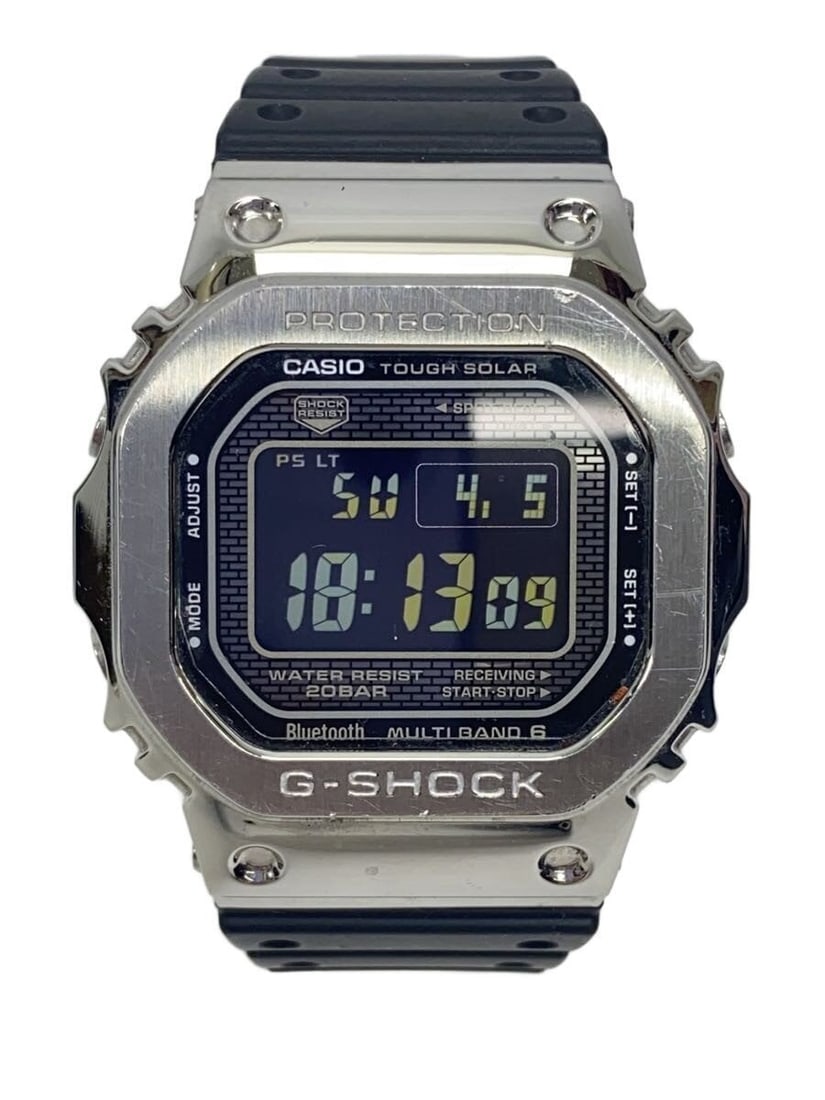 Casio GMW-B5000-1JF Silver Men's Wristwatch: Casio GMW-B5000-1JF Silver Men's Wristwatch This CASIO G-SHOCK GMW-B5000-1JF men's wristwatch features a silver-tone design with a robust build. Made in Japan, this pre-owned watch shows minor stains 