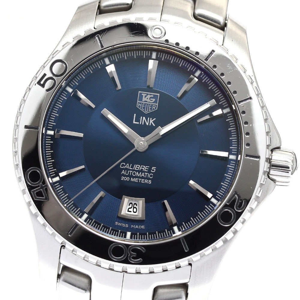 TAG Heuer Link WJ201C Automatic Date Stainless Steel Men's Watch: TAG Heuer Link WJ201C Automatic Date Stainless Steel Men's Watch This TAG Heuer Link Caliber 5 men's wristwatch features a stainless steel case and bracelet with a navy dial. The watch is powered by a