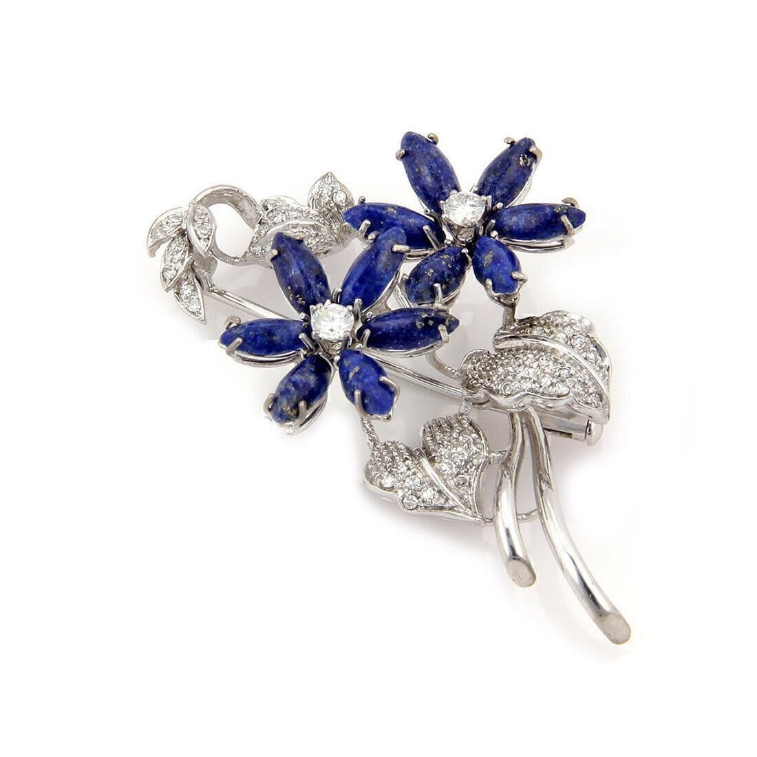 Floral lapis and diamond brooch in 18k white gold: Floral lapis and diamond brooch in 18k white gold This vintage brooch features an elegant floral design crafted from 18k white gold. The piece is adorned with sparkling diamonds totaling 0.85 carats a