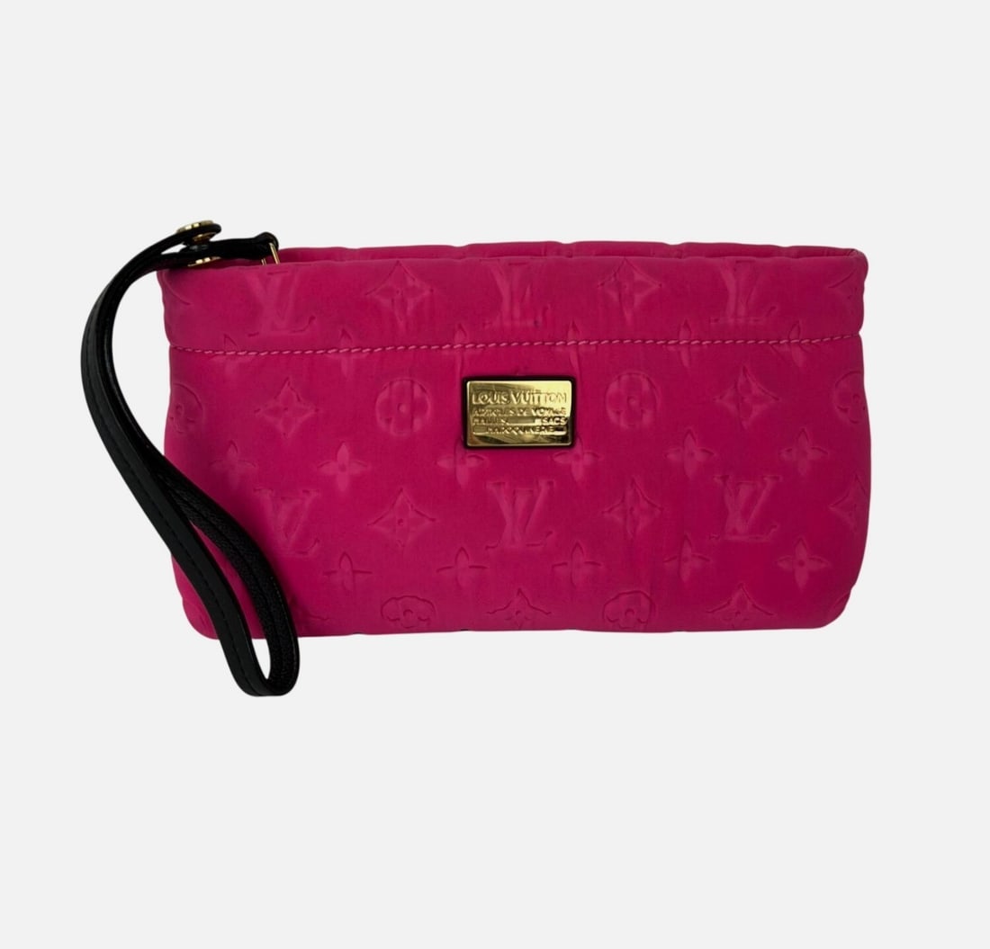 Scuba Fuchsia Canvas Wristlet Clutch by Louis Vuitton Limited Edition: Scuba Fuchsia Canvas Wristlet Clutch by Louis Vuitton Limited Edition This Louis Vuitton Scuba Fuchsia Pochette is a limited edition clutch bag designed in a rectangular shape. Crafted from fuchsia ca