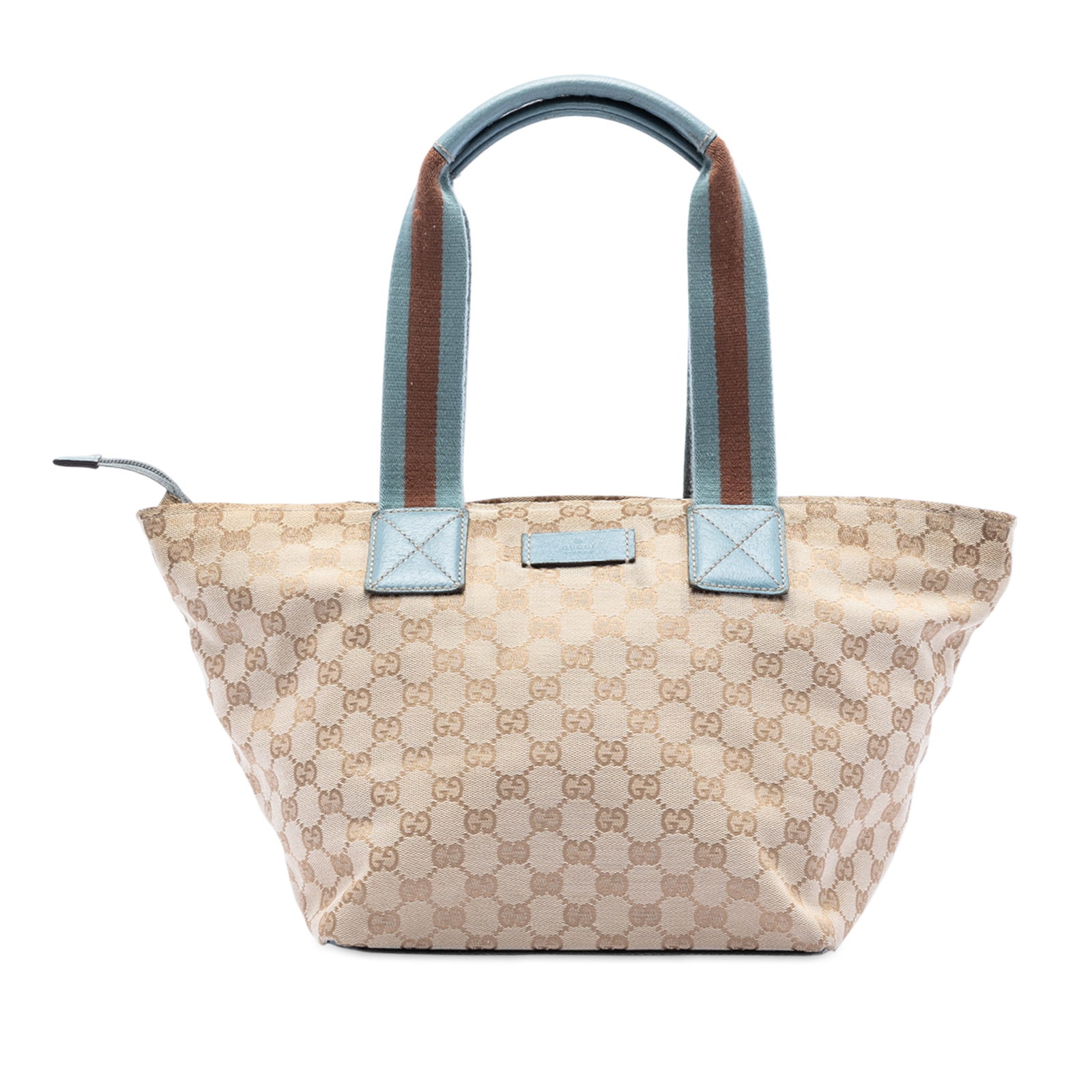 Brown GG Canvas Web Tote Bag with Leather Trim by Gucci: Brown GG Canvas Web Tote Bag with Leather Trim by Gucci This Gucci GG Canvas Web Tote features a brown canvas body with leather trim, flat straps, a top zip closure, and an interior zip pocket. Signs 