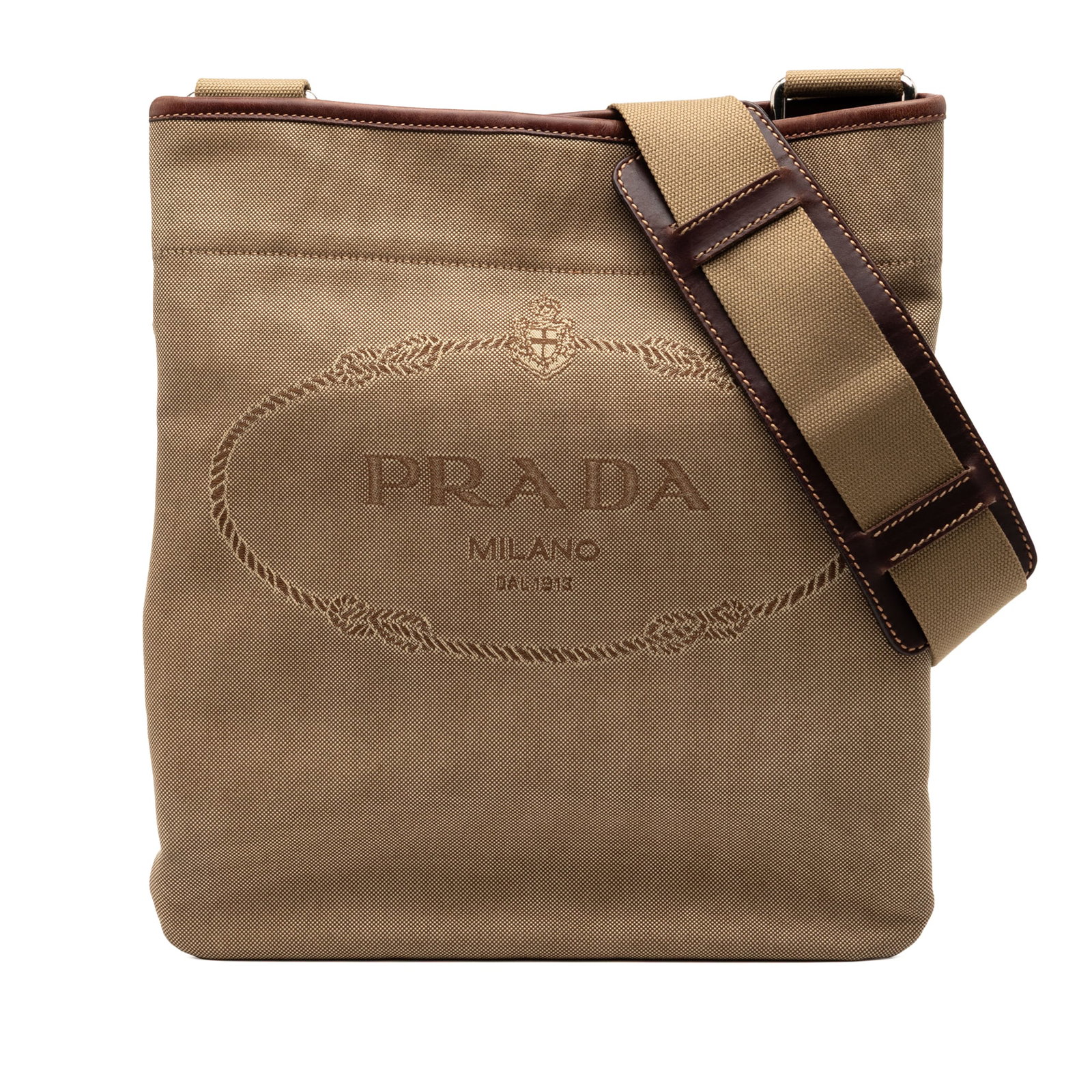 Prada Canapa Canvas Crossbody Bag with Logo and Leather Trim: Prada Canapa Canvas Crossbody Bag with Logo and Leather Trim This Prada Canvas Canapa Logo Crossbody bag features a canvas body with leather trim, an adjustable flat strap with a leather shoulder pad,