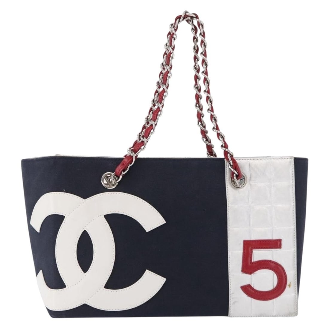 Navy Canvas and Leather Chanel No 5 Womens Tote Bag 29cm by 19cm by 15cm: Navy Canvas and Leather Chanel No 5 Womens Tote Bag 29cm by 19cm by 15cm Chanel No.5 Tote crafted from navy canvas with leather accents, designed for women. This tote features metal fittings and offer