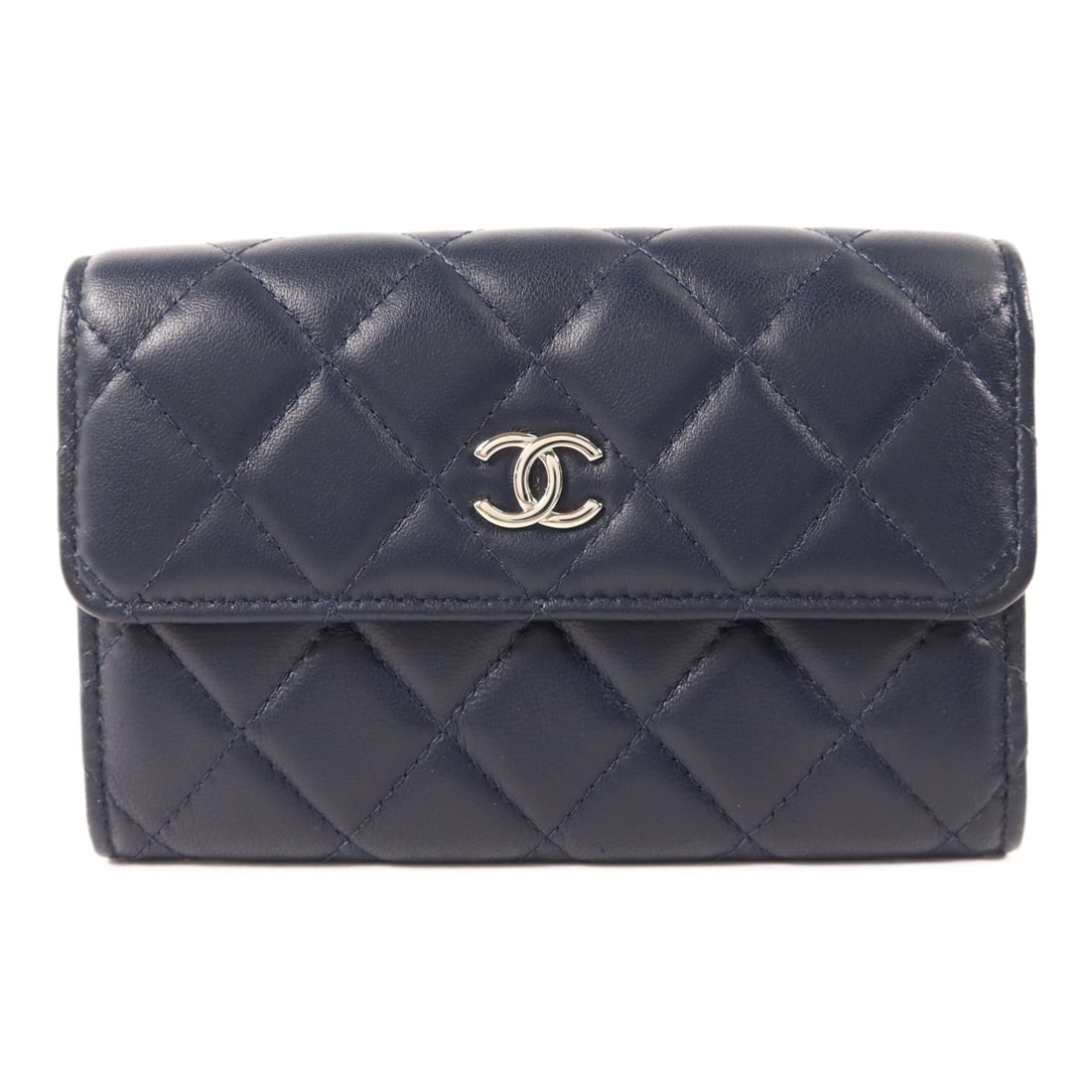 Chanel Navy Lambskin Leather Bifold Wallet with Silver CC Logo: Chanel Navy Lambskin Leather Bifold Wallet with Silver CC Logo This CHANEL bi-fold wallet is crafted from navy lambskin leather and features elegant silver-tone CC hardware. Designed for women, it off