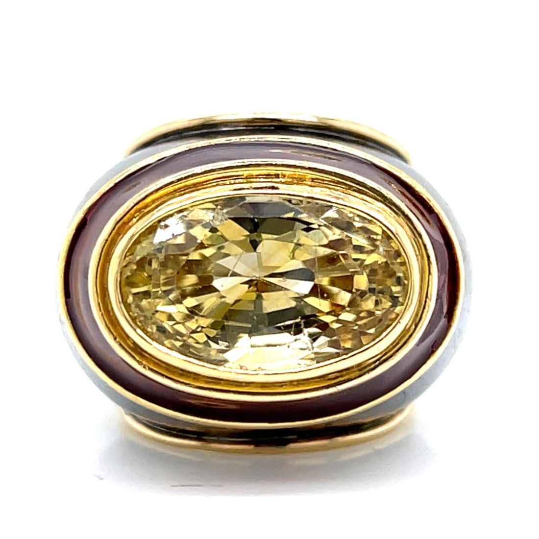 Yellow Sapphire Ring in 18K Gold and Silver Circa 1960s Size 4: Yellow Sapphire Ring in 18K Gold and Silver Circa 1960s Size 4 This 1960s ring features a yellow sapphire weighing approximately 12.00 ct, set in a combination of 18K yellow gold and silver. The ring 