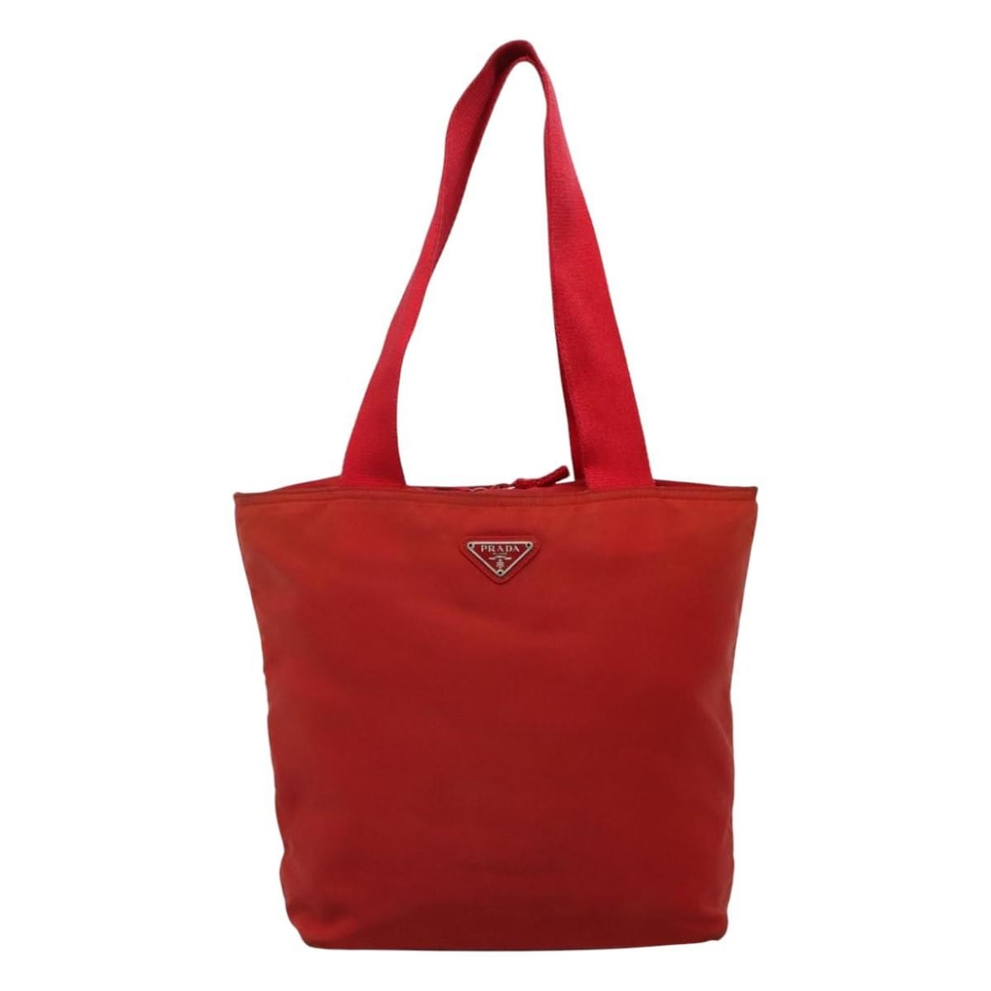 Red Nylon Tote Bag by Prada with Zip Closure Vintage Style: Red Nylon Tote Bag by Prada with Zip Closure Vintage Style This Prada Vintage Zip Tote is crafted from red nylon and designed for women. Made in Italy, it features a zip closure and comfortable handle