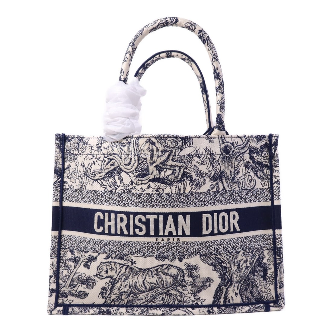 Dior Book Tote White Canvas Women's Handbag France 14.6 Inch: Dior Book Tote White Canvas Women's Handbag France 14.6 Inch This Christian Dior Book Tote Bag features a white canvas exterior and is designed for women. Made in France, the bag offers a sleek and ve