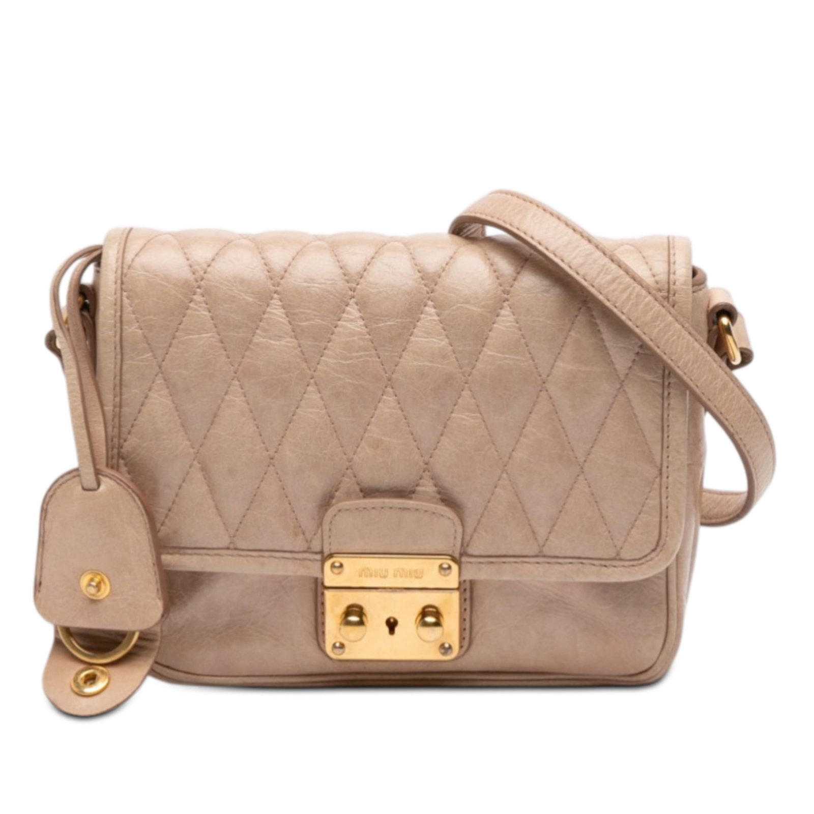 Beige Miu Miu Quilted Leather Crossbody Bag With Push Lock Flap: Beige Miu Miu Quilted Leather Crossbody Bag With Push Lock Flap This Miu Miu crossbody bag features a quilted leather exterior, an adjustable flat leather strap, and a front flap with a push lock clos