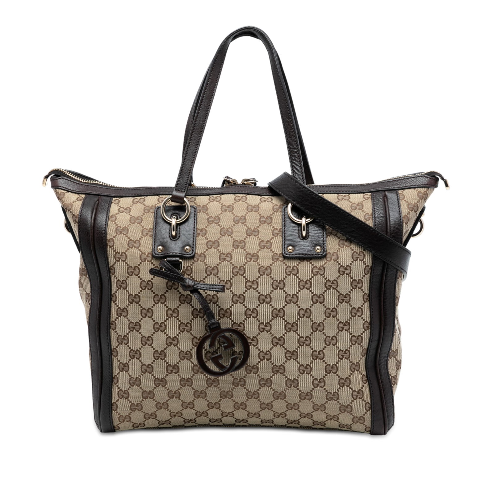 Brown Gucci GG Canvas Satchel with Charm Accent and Leather Trim: Brown Gucci GG Canvas Satchel with Charm Accent and Leather Trim This Gucci GG Canvas Charm Satchel features a brown canvas body with leather trim, flat leather handles, a detachable flat leather stra