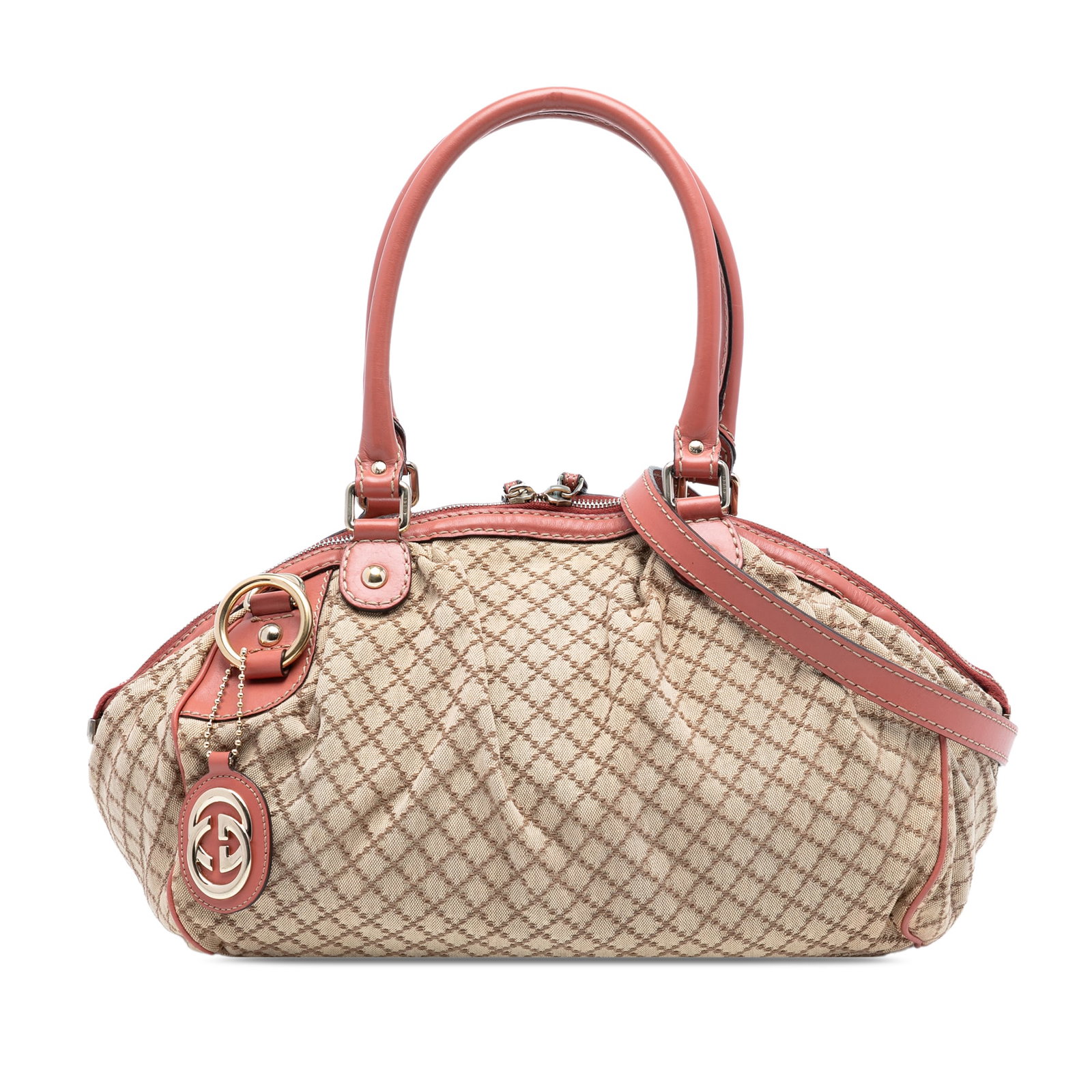 Gucci Sukey Beige Diamante Canvas Satchel with Leather Trim: Gucci Sukey Beige Diamante Canvas Satchel with Leather Trim The Gucci Diamante Canvas Sukey Satchel features a beige fabric canvas body with leather trim, rolled leather handles, and a top zip closure