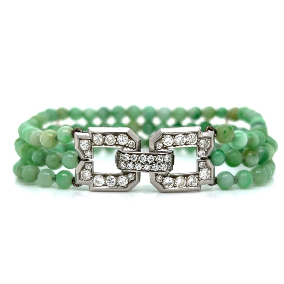 Platinum Art Deco Bracelet Featuring Jade and European Cut Diamonds: Platinum Art Deco Bracelet Featuring Jade and European Cut Diamonds This Art Deco bracelet is crafted from platinum and features jade and 38 European-cut diamonds with an approximate total weight of 2