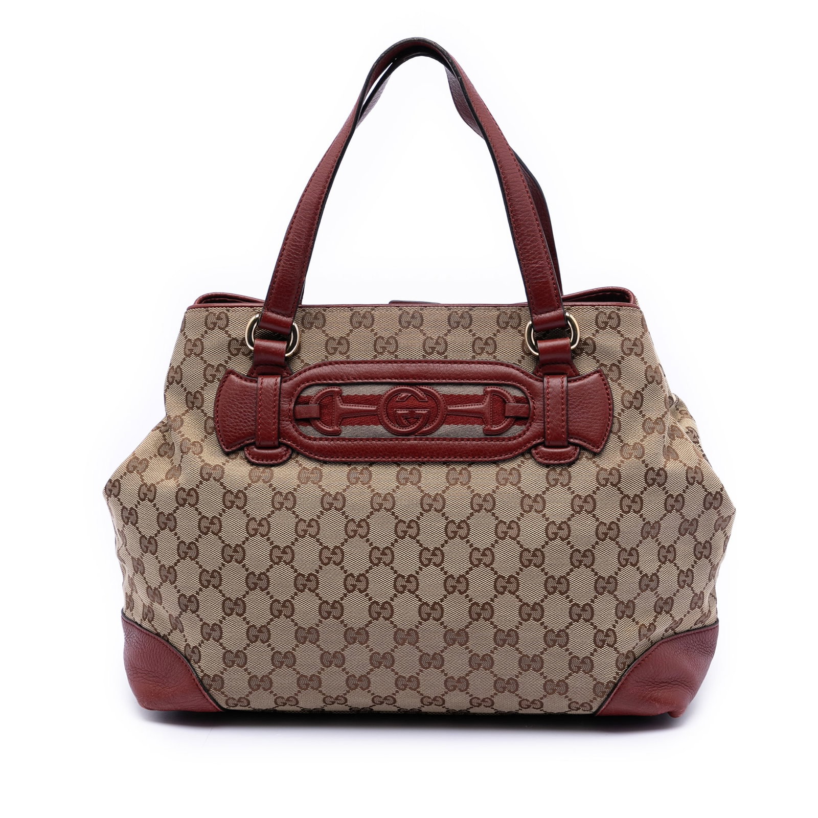 Gucci Dressage Tote Bag in GG Canvas with Web Detail: Gucci Dressage Tote Bag in GG Canvas with Web Detail This Gucci GG Canvas Web Dressage Tote features a canvas body with leather trim, flat leather handles, an open top with a magnetic snap closure, an