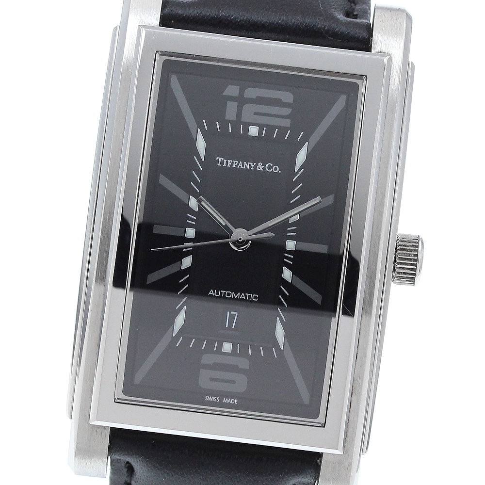 Tiffany Co Grand Date Automatic Men's Wristwatch: Tiffany Co Grand Date Automatic Men's Wristwatch This Tiffany & Co. Grand Date men's wristwatch features a stainless steel case with a black dial and an automatic movement. The watch includes a date f