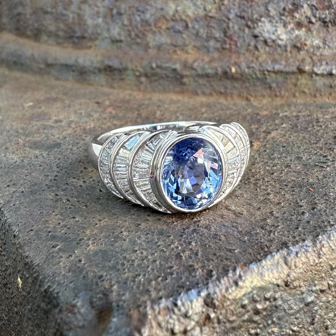 Cornflower Blue Sapphire and Diamond Cocktail Ring in 18k White Gold Size 6: Cornflower Blue Sapphire and Diamond Cocktail Ring in 18k White Gold Size 6 This women's cocktail ring features a natural oval-cut cornflower blue sapphire weighing approximately 2.22 carats, bezel se
