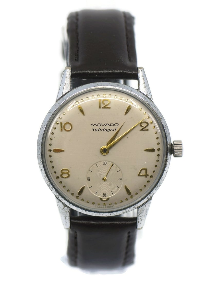 Movado Solidograf Vintage Mechanical Stainless Steel Watch 35mm: Movado Solidograf Vintage Mechanical Stainless Steel Watch 35mm This Movado Solidograf Vintage Wristwatch is a stunning piece that blends timeless elegance with functionality. Crafted from durable sta