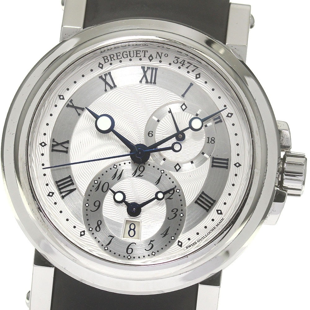 Breguet Marine GMT Date 5857 Men's Automatic Wristwatch: Breguet Marine GMT Date 5857 Men's Automatic Wristwatch This Breguet Marine GMT Date men's wristwatch features a stainless steel case paired with a silver dial and a rubber strap. The automatic moveme