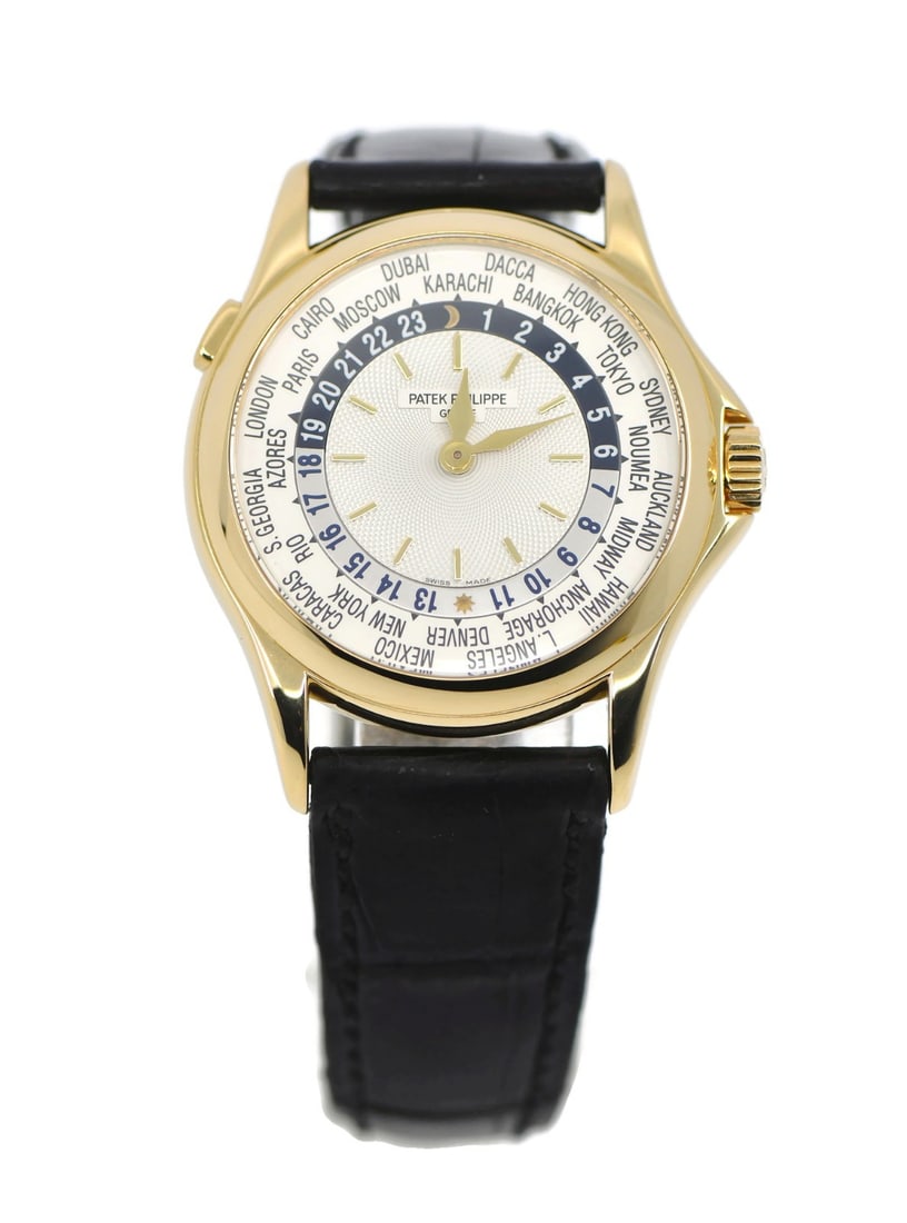 Patek Philippe 5110J World Time 18K Yellow Gold Automatic Watch with Box and Papers: Patek Philippe 5110J World Time 18K Yellow Gold Automatic Watch with Box and Papers The Patek Philippe World Time 5110J is a distinguished wristwatch featuring an 18K yellow gold case and a mechanical