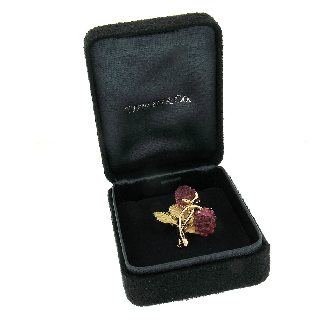 Tiffany & Co 18k Gold Carved Pink Tourmaline Leaf Brooch with Box: Tiffany & Co 18k Gold Carved Pink Tourmaline Leaf Brooch with Box This exquisite brooch from Tiffany & Co. features a stunning design of carved pink tourmaline set against textured leaves, embodying a