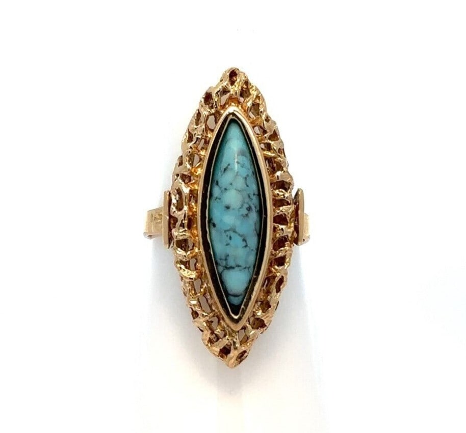 Vintage 18K Gold Marquise Turquoise Cocktail Ring Sizable: Vintage 18K Gold Marquise Turquoise Cocktail Ring Sizable This stunning vintage cocktail ring features a captivating marquise-shaped turquoise gemstone, expertly bezel set in luxurious 18K yellow gold