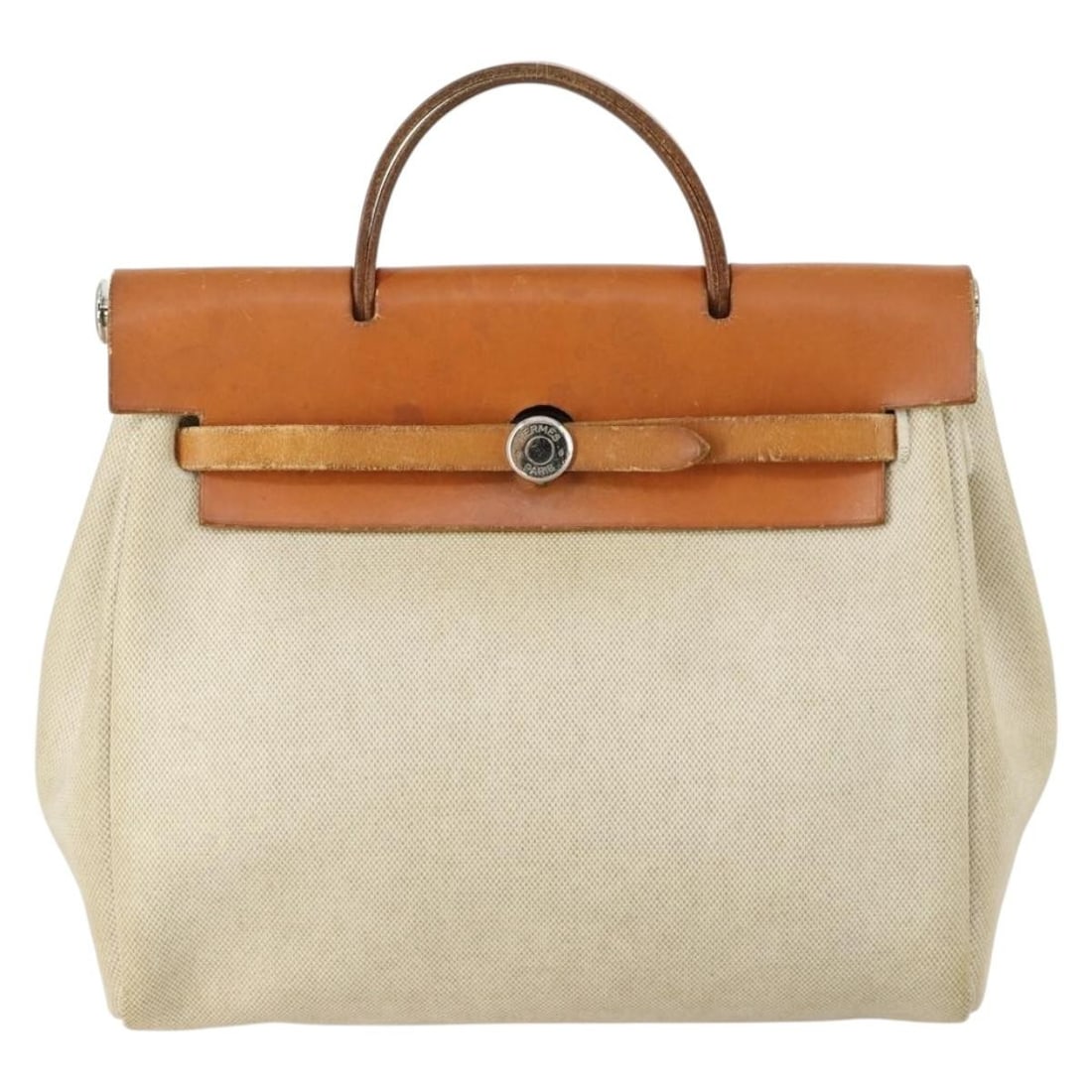 Beige Canvas Herbag A Dos Backpack by Hermes 28cm by 32cm by 10cm: Beige Canvas Herbag A Dos Backpack by Hermes 28cm by 32cm by 10cm This Hermes Herbag A Dos Backpack for women features a beige canvas exterior with leather details. The bag measures 28cm x 32cm x 10cm