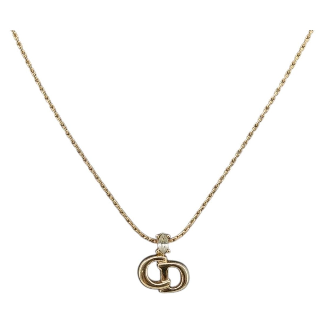 Gold Tone Metal Necklace by Christian Dior Germany: Gold Tone Metal Necklace by Christian Dior Germany This Christian Dior necklace features a gold tone metal construction, designed for women. The necklace measures approximately 40 cm (15.7 inches) in 