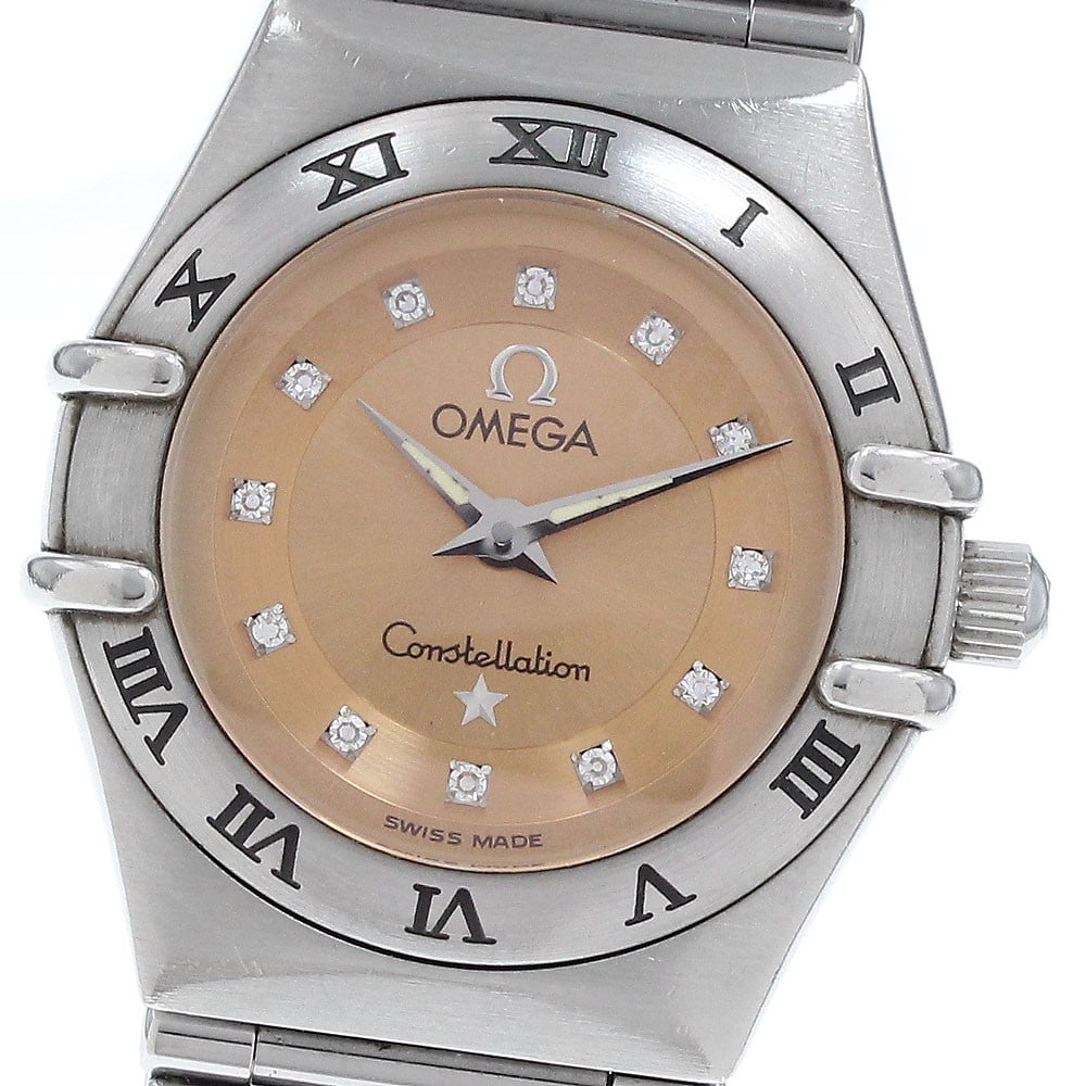 Omega Constellation Cindy Crawford Quartz Ladies Watch 1564.65 Orange Dial: Omega Constellation Cindy Crawford Quartz Ladies Watch 1564.65 Orange Dial This Omega Constellation Cindy Crawford quartz ladies watch features a stainless steel case and bracelet, complemented by an 
