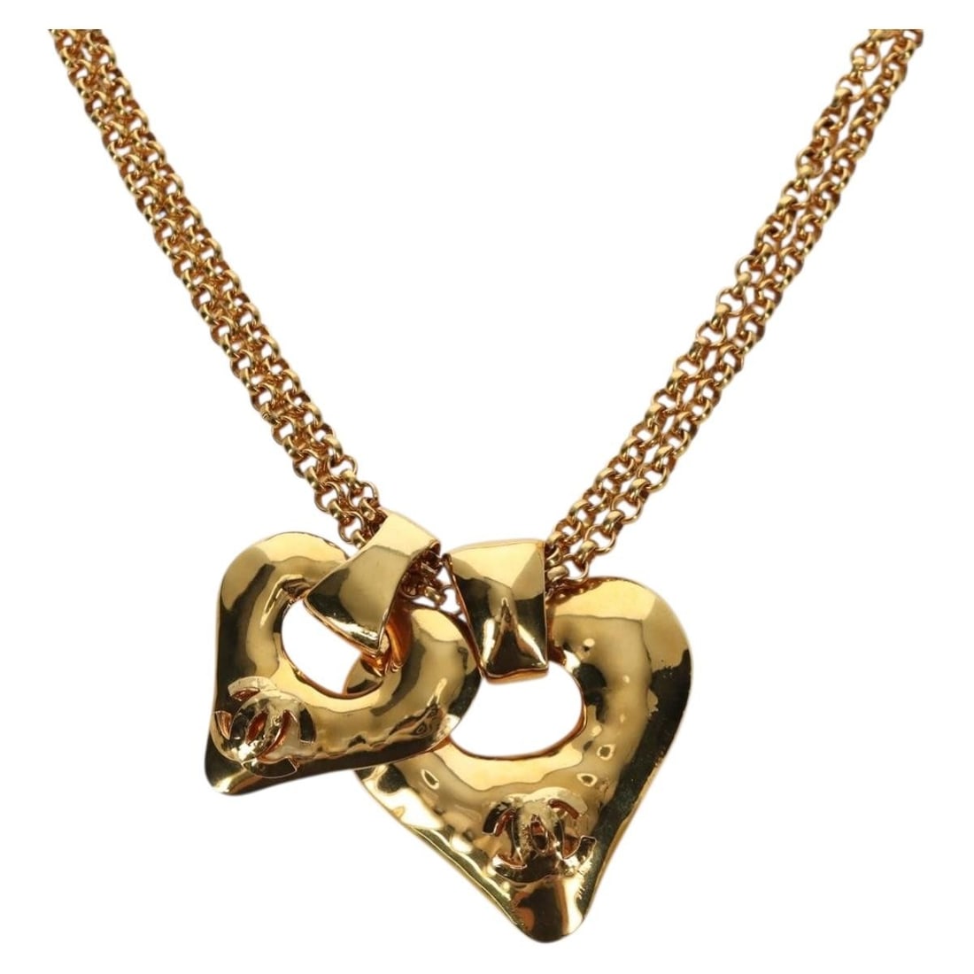 Gold Tone Metal Heart Pendant Necklace by CHANEL France: Gold Tone Metal Heart Pendant Necklace by CHANEL France This CHANEL heart necklace features a gold tone metal design with the iconic CC logo. Designed for women, it is crafted in France and measures a