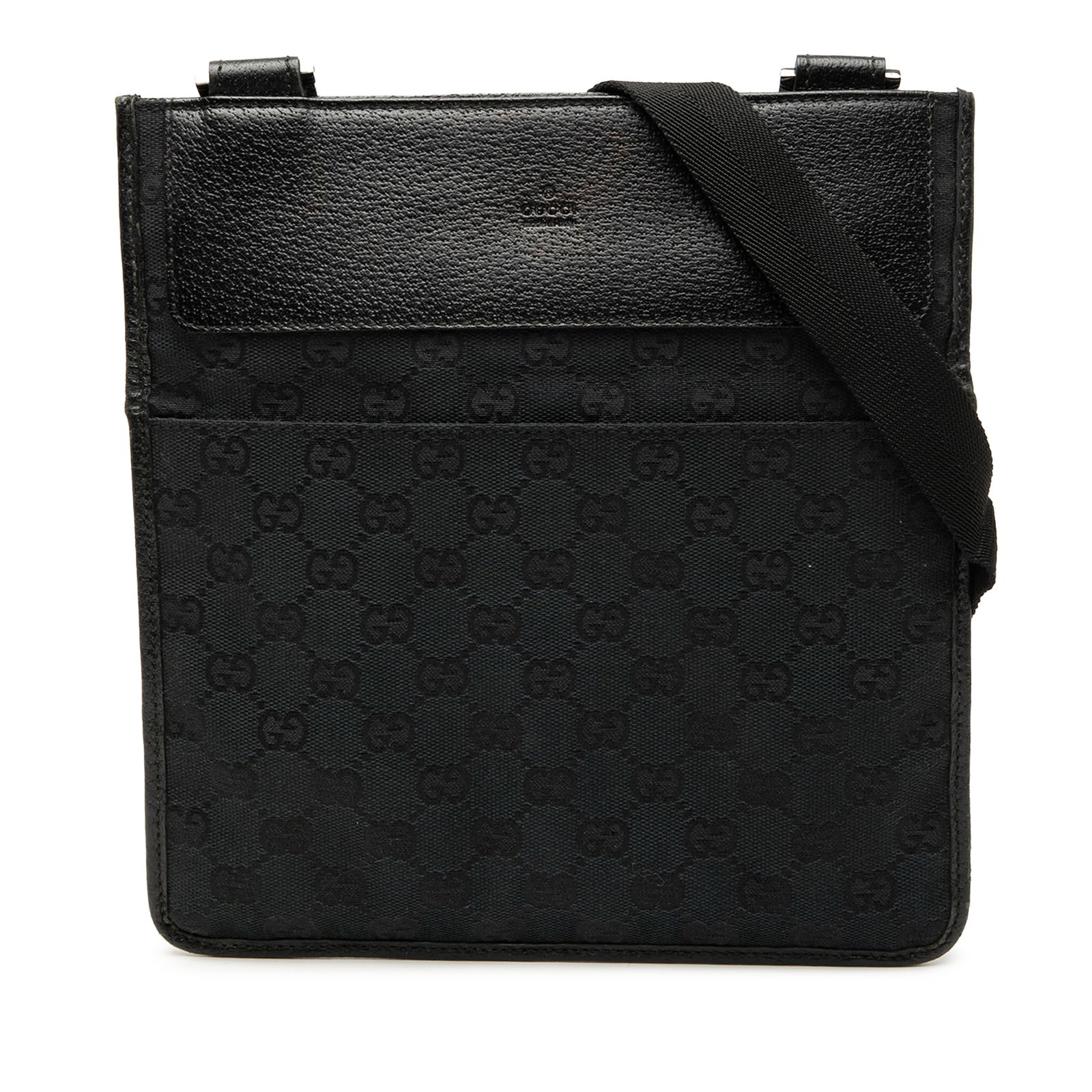 Black GG Canvas Crossbody Bag with Leather Trim by Gucci: Black GG Canvas Crossbody Bag with Leather Trim by Gucci This Gucci GG Canvas Crossbody bag features a canvas body with leather trim, an adjustable flat strap, an open top with touch fastener closure,