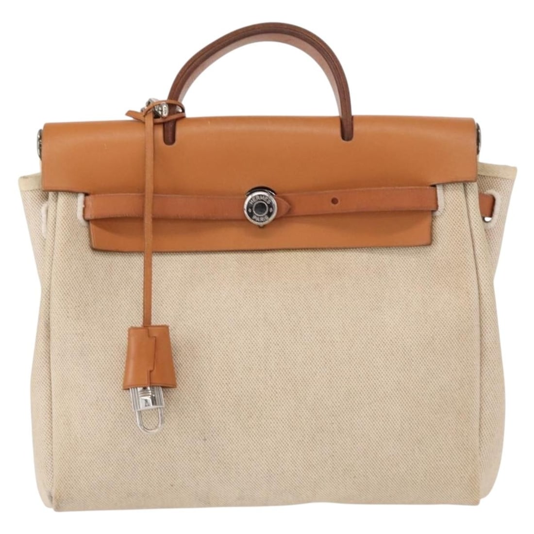 Beige Canvas Herbag A Dos Female Backpack by Hermes 29cm x 24cm x 10cm: Beige Canvas Herbag A Dos Female Backpack by Hermes 29cm x 24cm x 10cm This Hermes Herbag A Dos backpack is crafted from beige canvas and designed for women. It features a compact silhouette suitable 