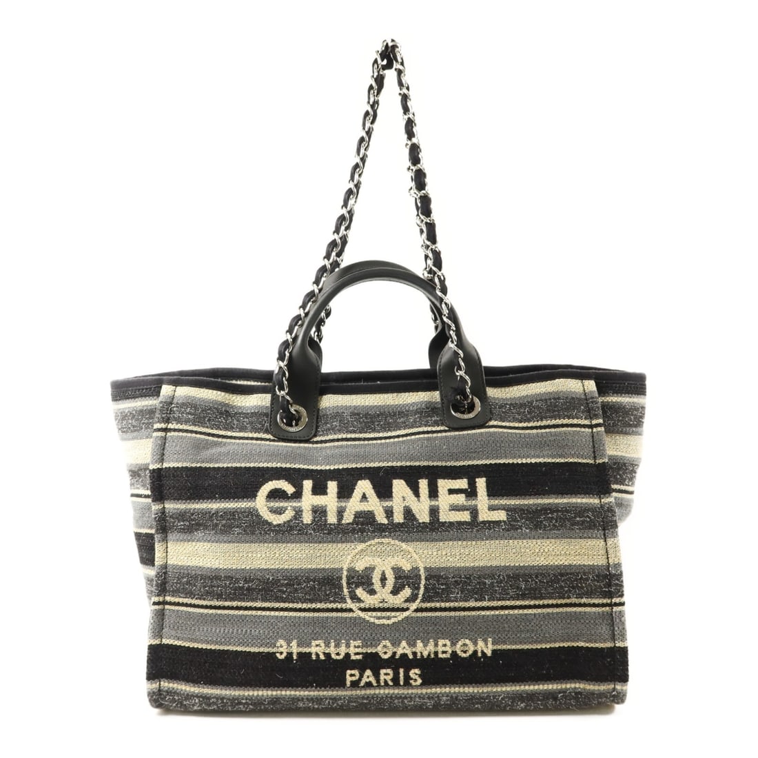 Chanel Deauville Canvas Shoulder Bag Black and Gray with Silver Hardware: Chanel Deauville Canvas Shoulder Bag Black and Gray with Silver Hardware This CHANEL Deauville 2 Way Shoulder Bag features a black and gray canvas exterior, offering both style and versatility. Design