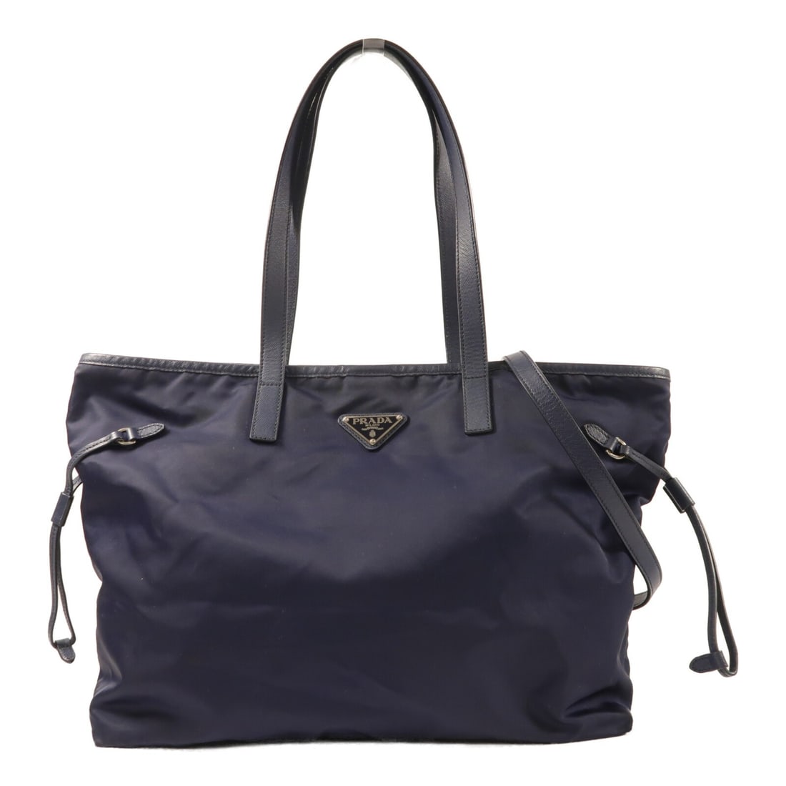 Prada Navy Nylon Convertible SHW Shoulder Bag Italy: Prada Navy Nylon Convertible SHW Shoulder Bag Italy This Prada 2-way shoulder bag is crafted from navy nylon and designed for women. Featuring both shoulder and handheld carrying options, it combines 