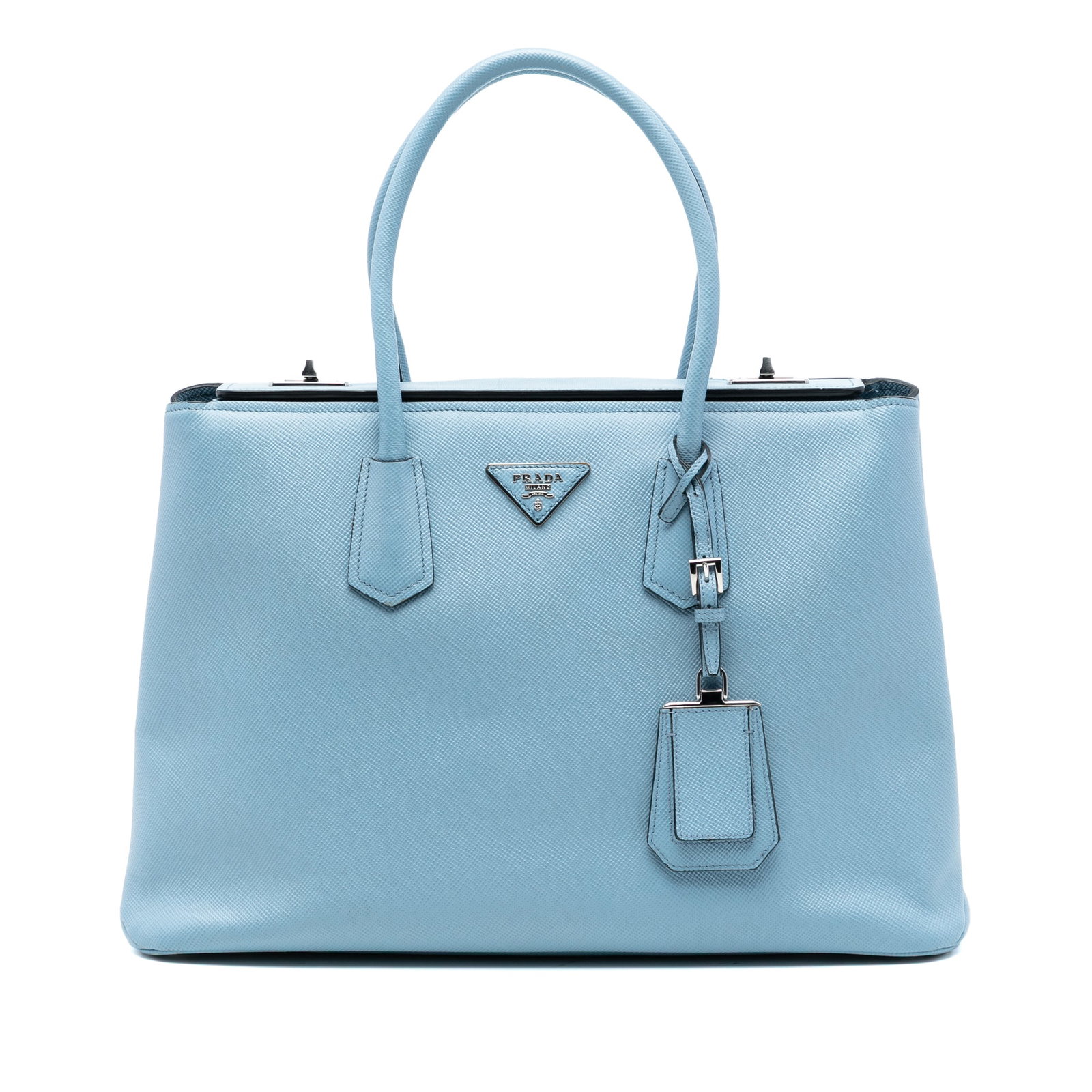 Prada Saffiano Leather Twin Satchel with Turnlock Closures Blue: Prada Saffiano Leather Twin Satchel with Turnlock Closures Blue This Prada Saffiano Cuir Turnlock Twin Satchel features a blue saffiano leather exterior with rolled leather handles and a fold-over top