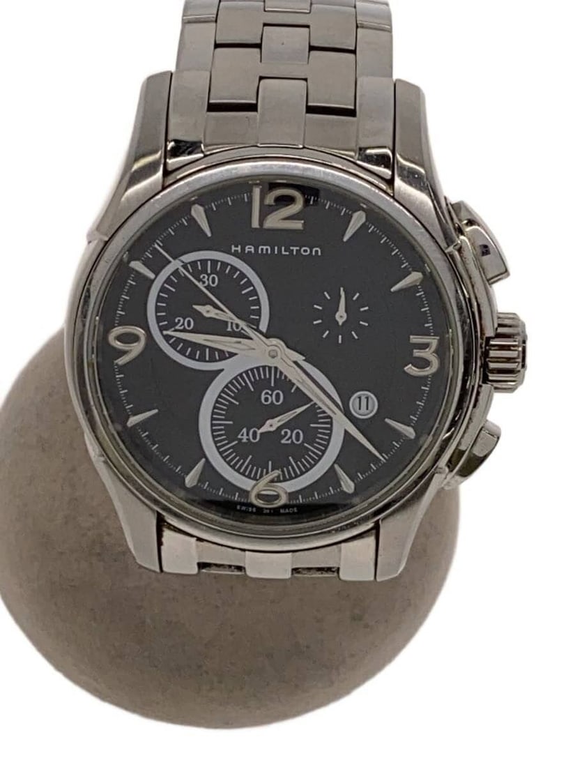 Hamilton Jazzmaster Black Quartz Wristwatch for Men: Hamilton Jazzmaster Black Quartz Wristwatch for Men This Hamilton Jazzmaster Quartz men's wristwatch features a black dial and a Swiss-made quartz movement. The watch is pre-owned and exhibits slight 
