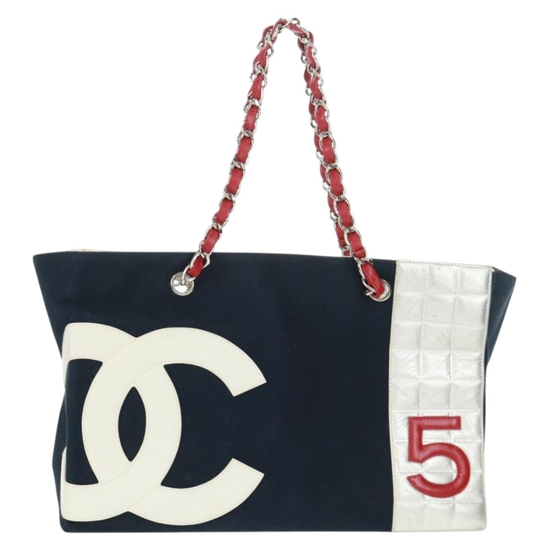 Navy Canvas and Leather No.5 Tote Bag by Chanel: Navy Canvas and Leather No.5 Tote Bag by Chanel This Chanel No.5 Tote is crafted from navy canvas with leather accents, designed for women. The tote features a spacious interior and is made in Italy. 