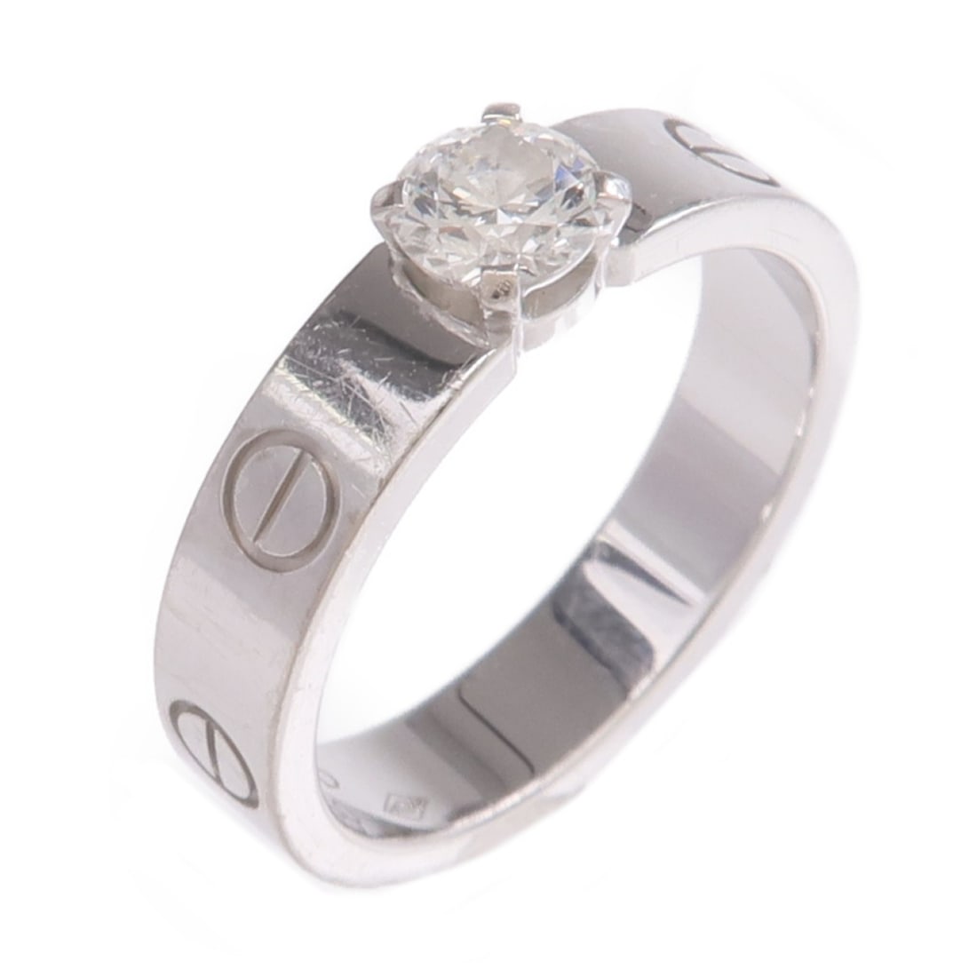 Cartier Love diamond ring 18K white gold size 5: Cartier Love diamond ring 18K white gold size 5 This Cartier Love Solitaire ring features a brilliant cut diamond set in 18K white gold. Designed for women, it showcases Cartier's signature elegance a