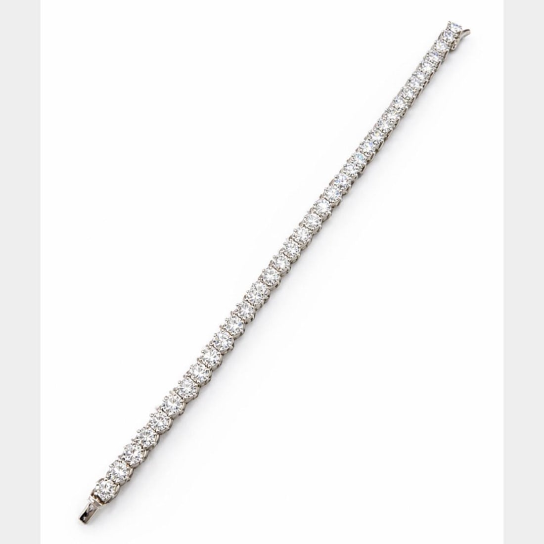 Diamond Tennis Bracelet 18K White Gold 11.00 Carat 7 Inch Length: Diamond Tennis Bracelet 18K White Gold 11.00 Carat 7 Inch Length This elegant tennis bracelet is crafted from 18K white gold and features approximately 11.00 carats of diamonds. The bracelet is set wi