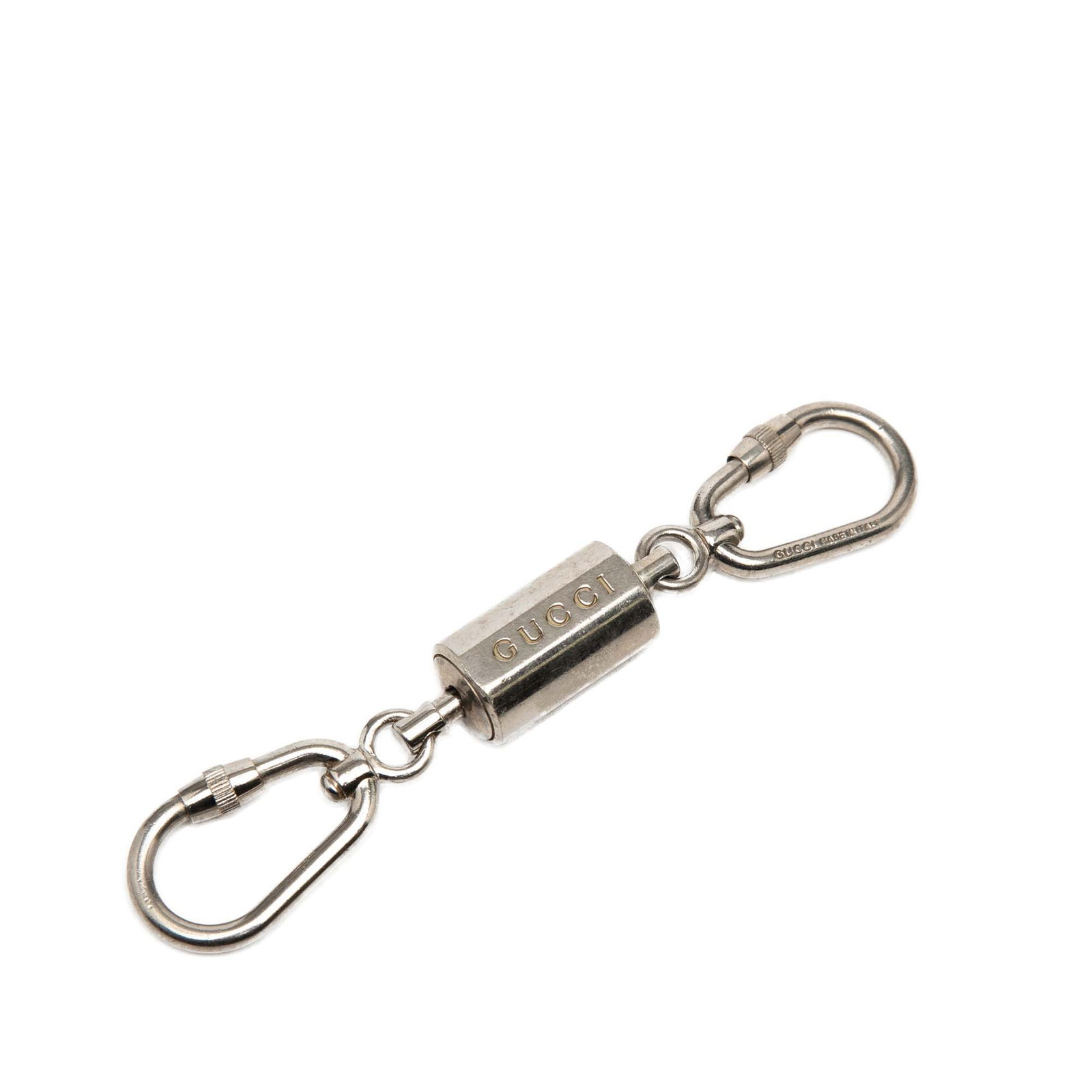 Gucci Metal Silver Tone Carabiner Key Holder Accessory: Gucci Metal Silver Tone Carabiner Key Holder Accessory This Gucci key chain features a silver-tone metal body with clasp closures. The accessory is crafted in Italy and is designed with a carabiner st
