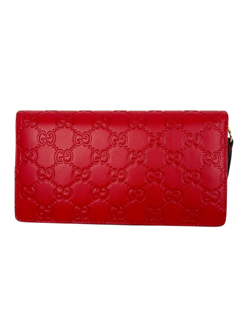 Red Leather Zip Wallet with Guccisima Pattern by Gucci: Red Leather Zip Wallet with Guccisima Pattern by Gucci This Gucci zip-around wallet clutch is crafted from red Guccisima leather and features a solid pattern with logo detailing. Designed for women, i