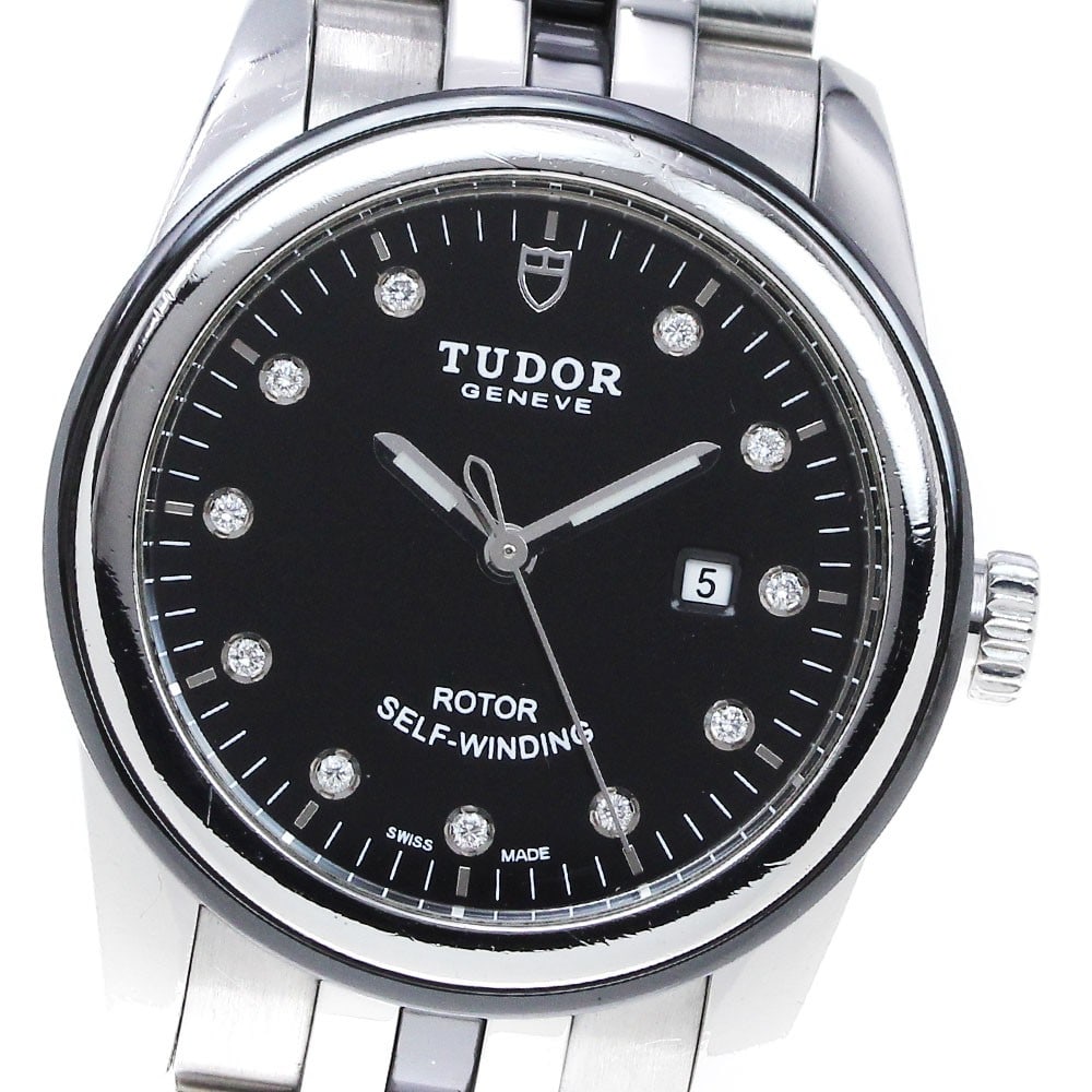 TUDOR Glamour Date 53010 Womens Automatic Wristwatch: TUDOR Glamour Date 53010 Womens Automatic Wristwatch This Tudor Glamour Date ladies wristwatch features a stainless steel and ceramic case and bracelet, complemented by a black dial. The watch is powe