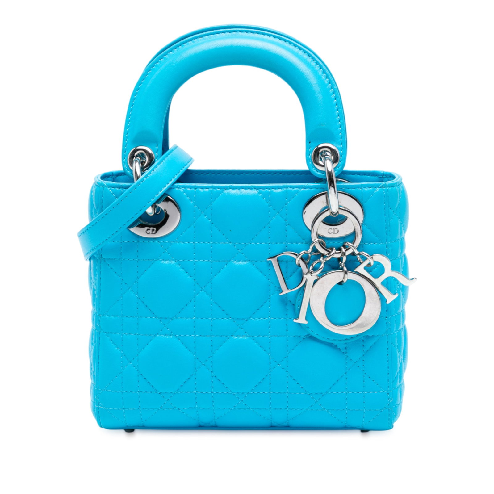 Dior Mini Lambskin Cannage Lady Dior Blue Handbag: Dior Mini Lambskin Cannage Lady Dior Blue Handbag Introducing the Mini Lady Dior, a luxurious handbag crafted from exquisite quilted lambskin leather in a stunning blue hue. This elegant bag features 