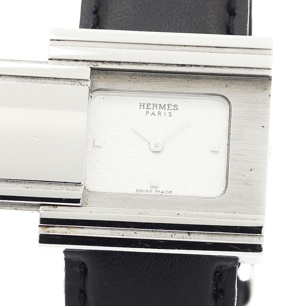 Hermes Grizzard GL1.510 Quartz Ladies Wristwatch: Hermes Grizzard GL1.510 Quartz Ladies Wristwatch This Hermes Grizard GL1.510 women's wristwatch features a stainless steel case paired with an unused non-OEM leather band and a silver dial. The quartz
