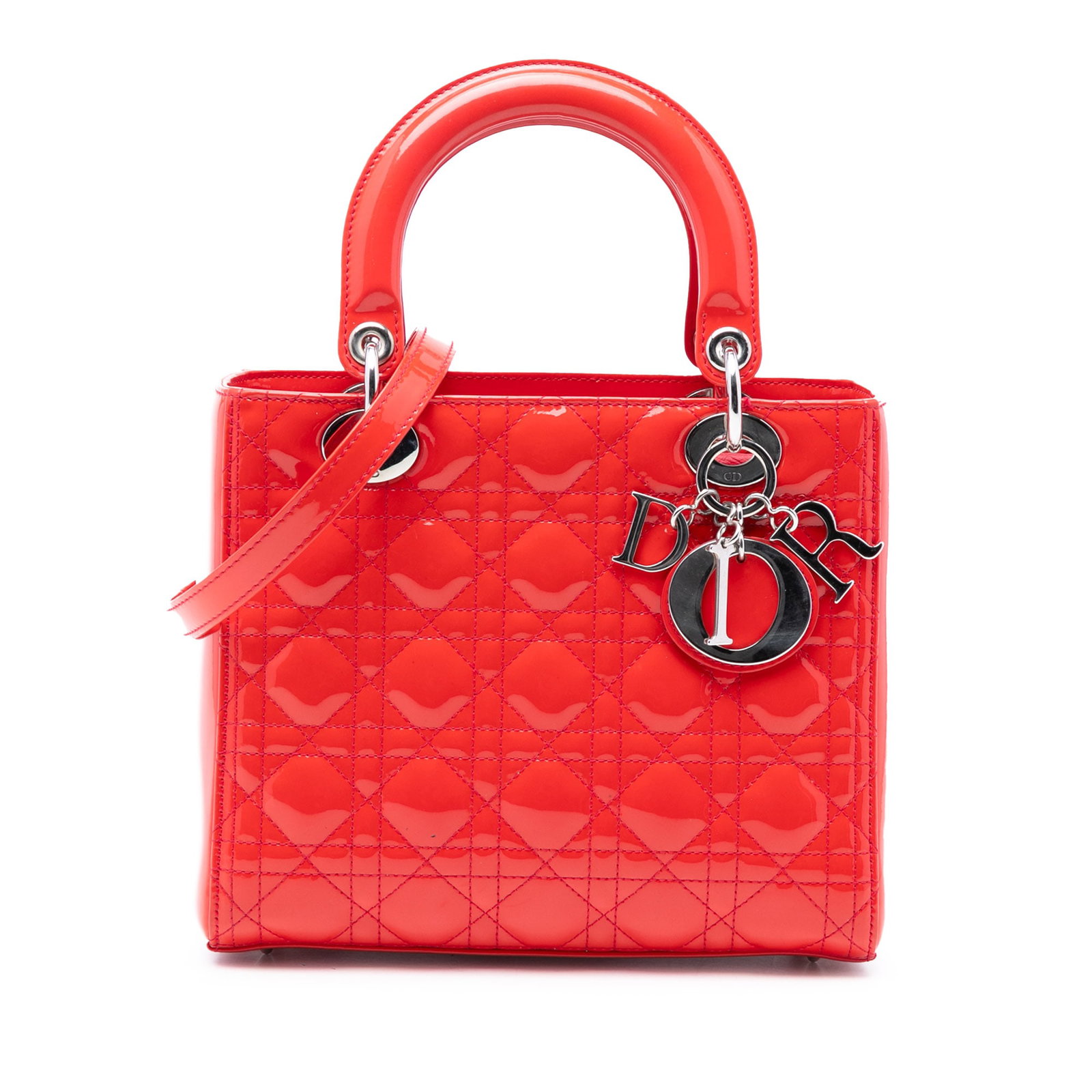 Dior Lady Dior Medium Orange Patent Leather Cannage Handbag with Strap: Dior Lady Dior Medium Orange Patent Leather Cannage Handbag with Strap This Lady Dior Medium handbag features a vibrant orange patent leather body with cannage stitching, flat top handles, a detachabl