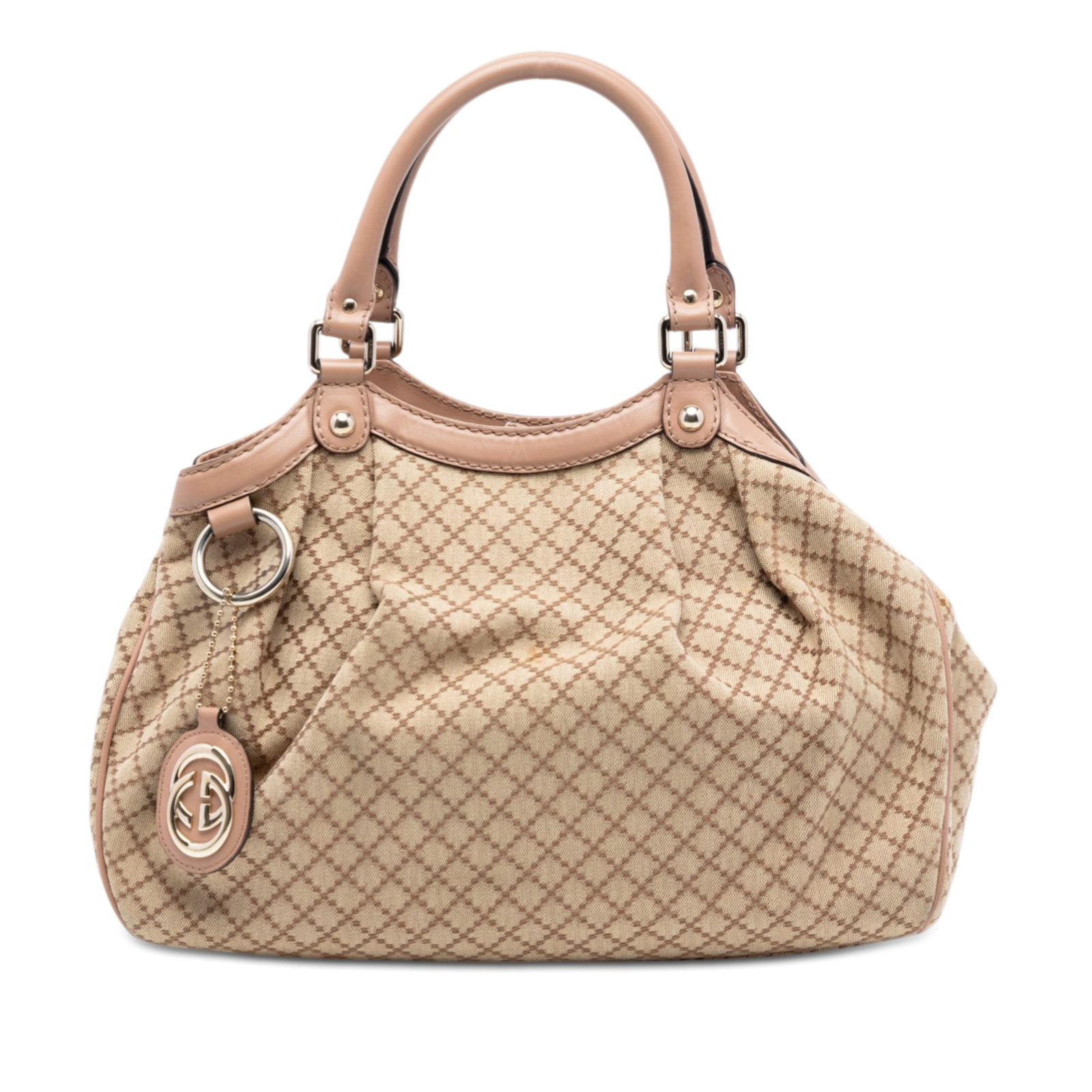 Gucci Sukey Beige Canvas Tote with Leather Trim Medium Size: Gucci Sukey Beige Canvas Tote with Leather Trim Medium Size This Gucci Medium Diamante Canvas Sukey Tote features a beige canvas body with leather trim, rolled leather handles, an open top with magnet
