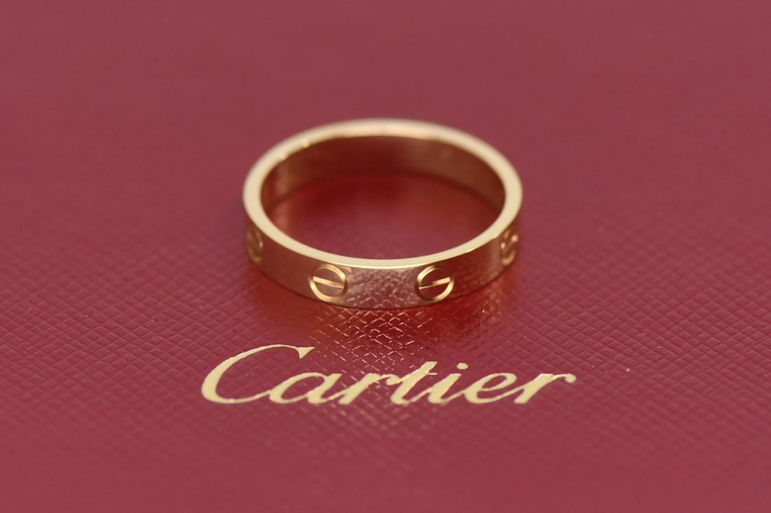 Cartier 18K Yellow Gold Love Band Size 53: Cartier 18K Yellow Gold Love Band Size 53 This Cartier Love ring is crafted from 18K yellow gold and features the iconic Love design. The ring is a size 53 (equivalent to US size 6.5), with a width of