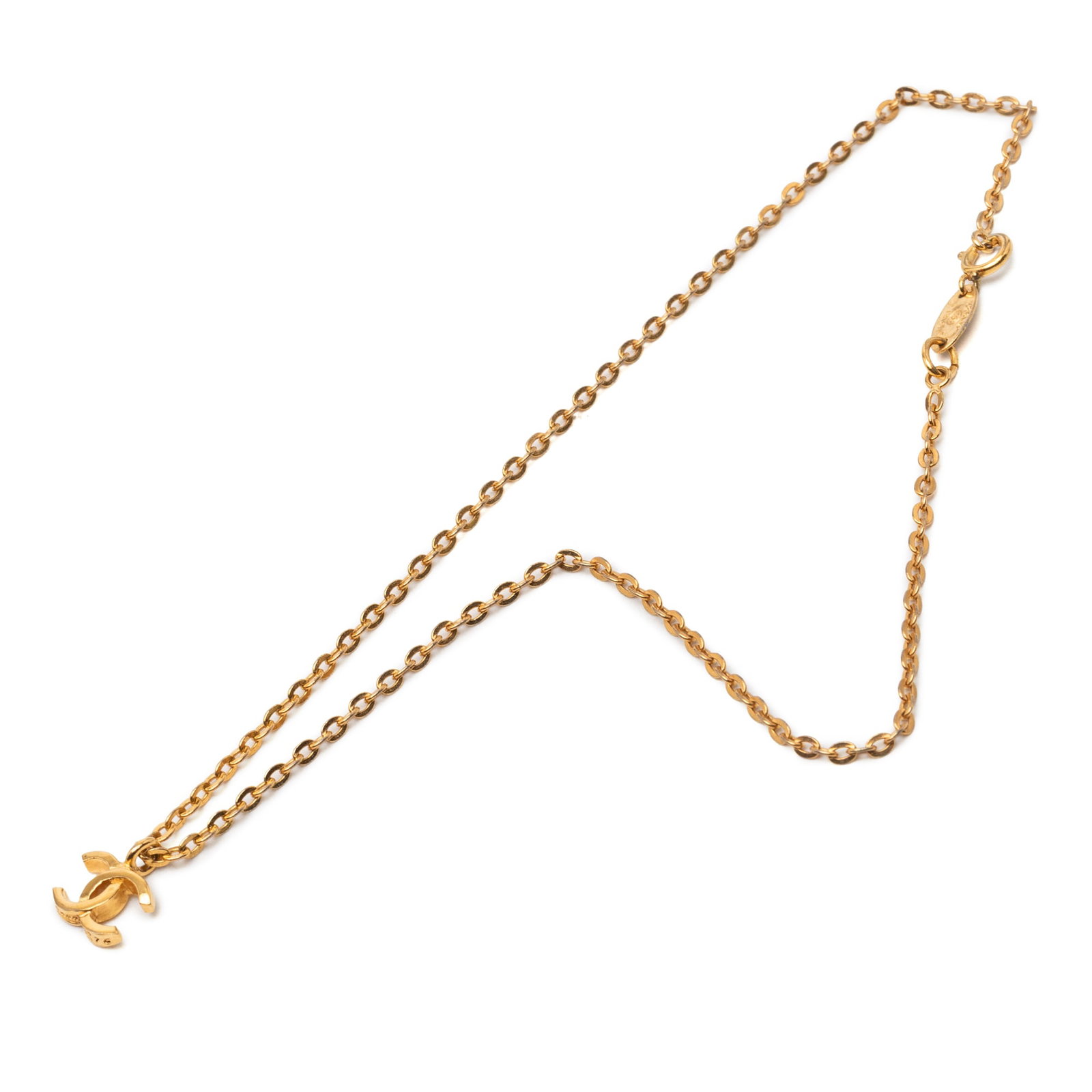 Chanel CC Logo Gold Tone Pendant Necklace: Chanel CC Logo Gold Tone Pendant Necklace This Chanel necklace features a gold-tone metal pendant with the iconic CC logo and a matching chain, secured with a spring ring closure. The necklace shows s