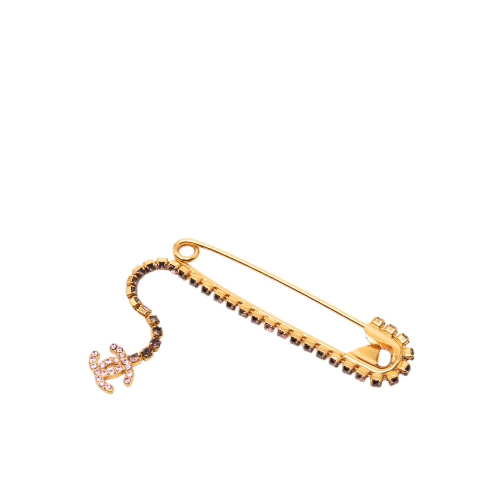 Chanel Crystal Accent Gold Tone Safety Pin Brooch with CC Charm: Chanel Crystal Accent Gold Tone Safety Pin Brooch with CC Charm This Chanel CC brooch features a gold-tone plated metal body adorned with crystal embellishments and a CC charm. It secures with a pin c