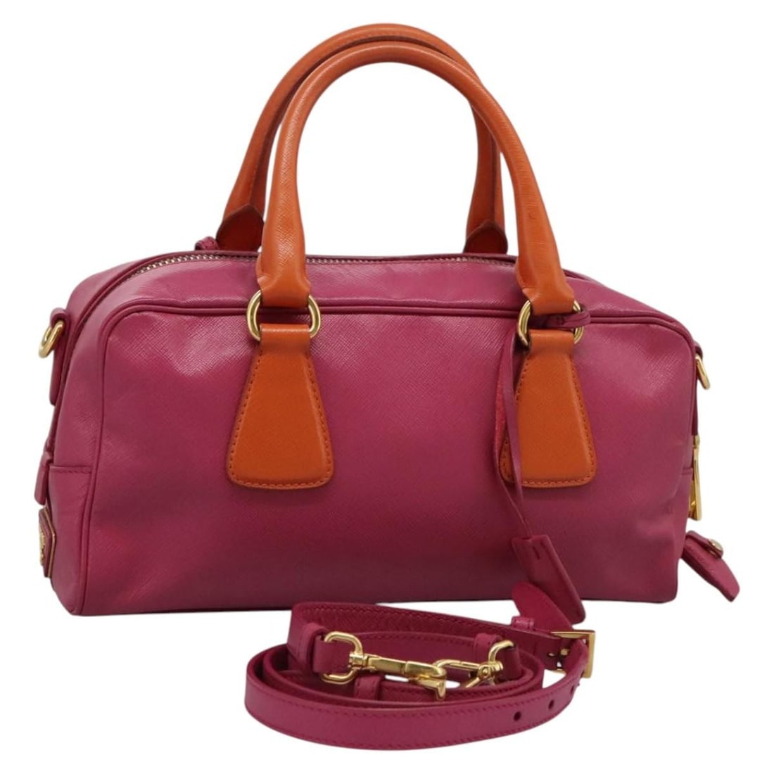 Prada Saffiano Pink Gold Leather 2way Handbag With Strap And Accessories: Prada Saffiano Pink Gold Leather 2way Handbag With Strap And Accessories This Prada women's handbag is crafted from Saffiano leather in a stylish pink and gold color combination. It features both top 