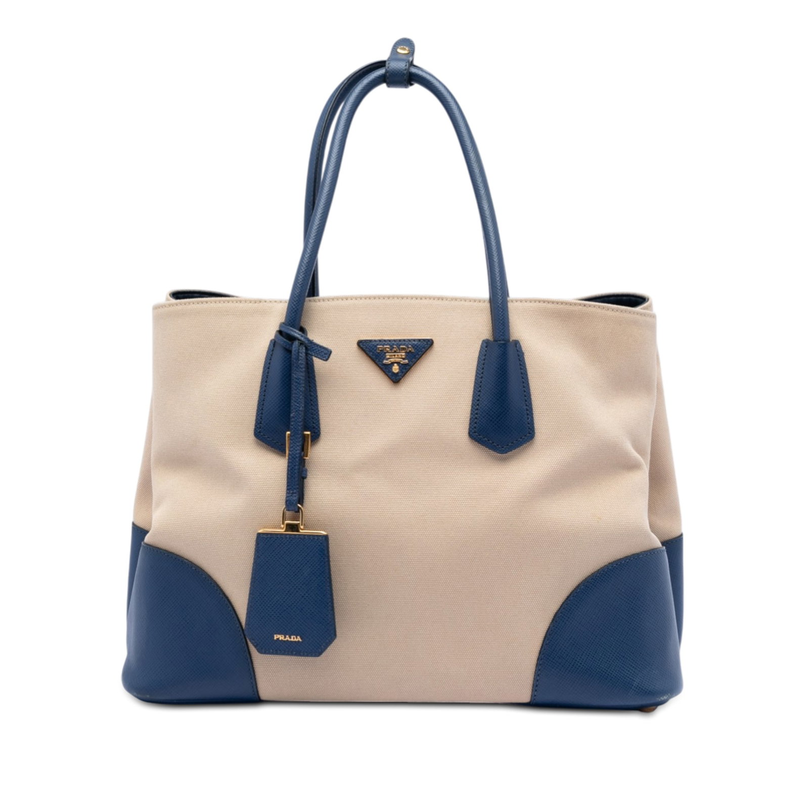 Prada Beige Canvas Satchel with Saffiano Leather Trim and Shoulder Strap: Prada Beige Canvas Satchel with Saffiano Leather Trim and Shoulder Strap This Prada Large Canapa and Saffiano Double Satchel features a beige canvas body accented with saffiano leather trim and rolled